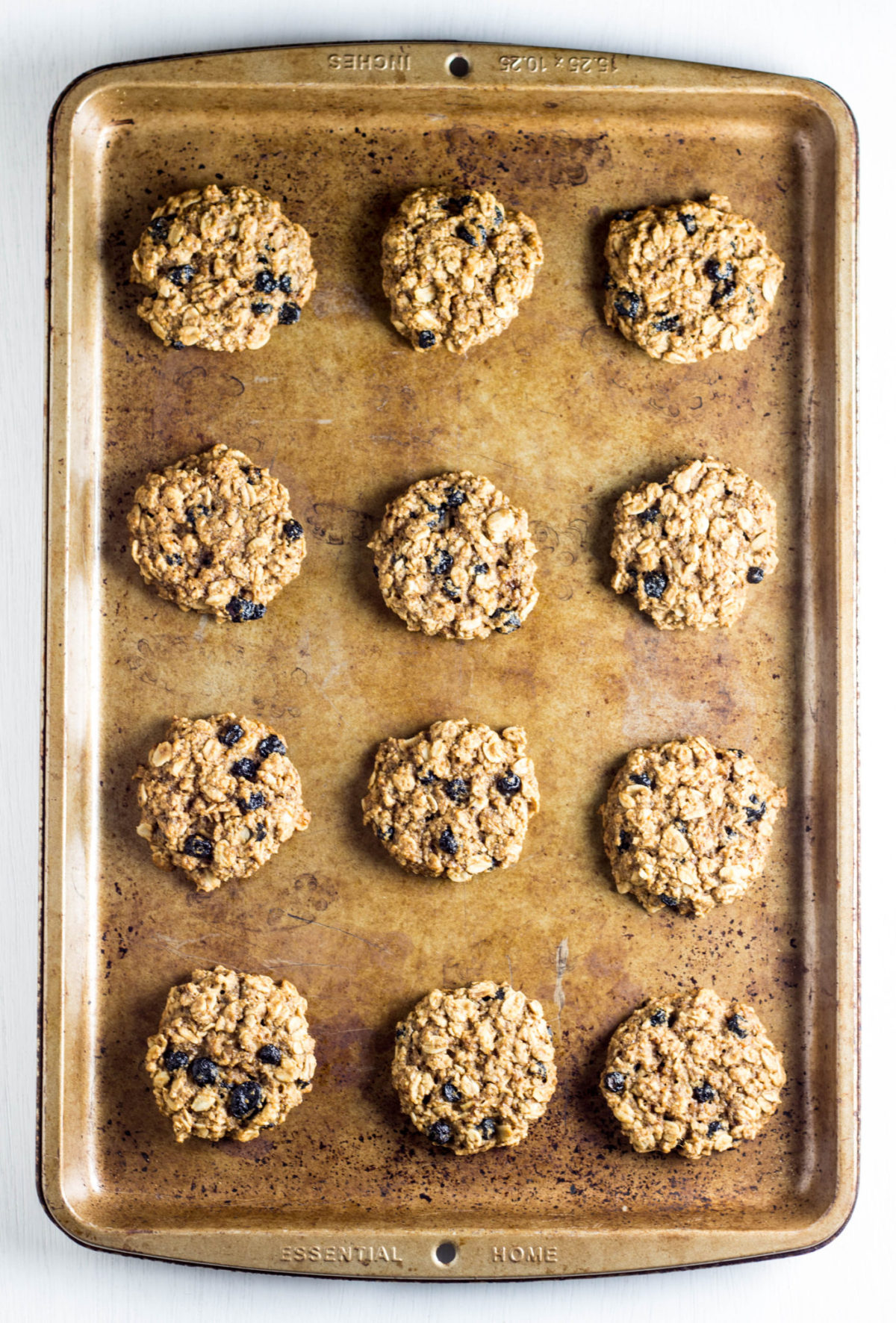 Top view of cookies on a baking sheet against a white background. 