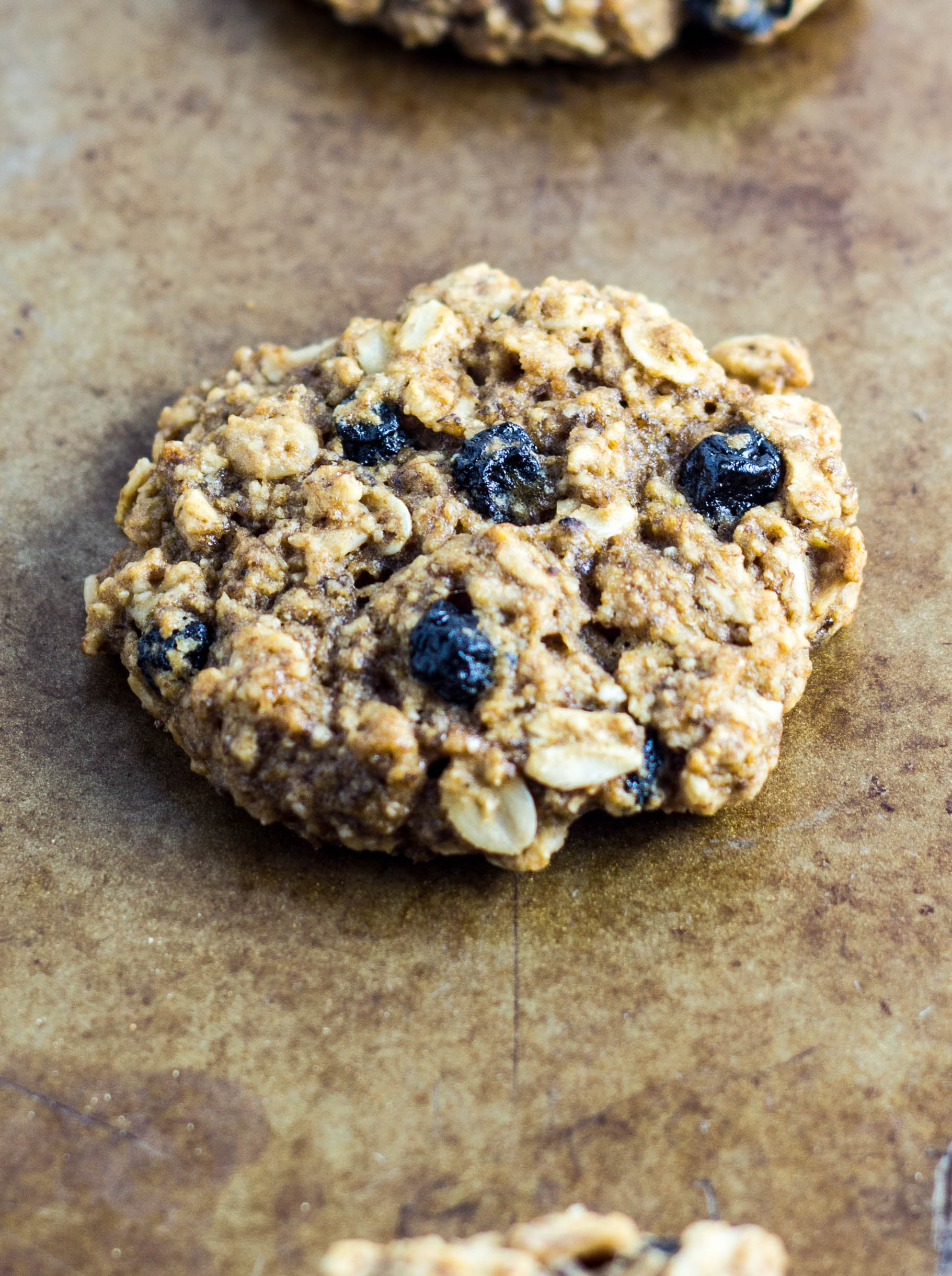 Close up of a cookie on a baking sheet. 