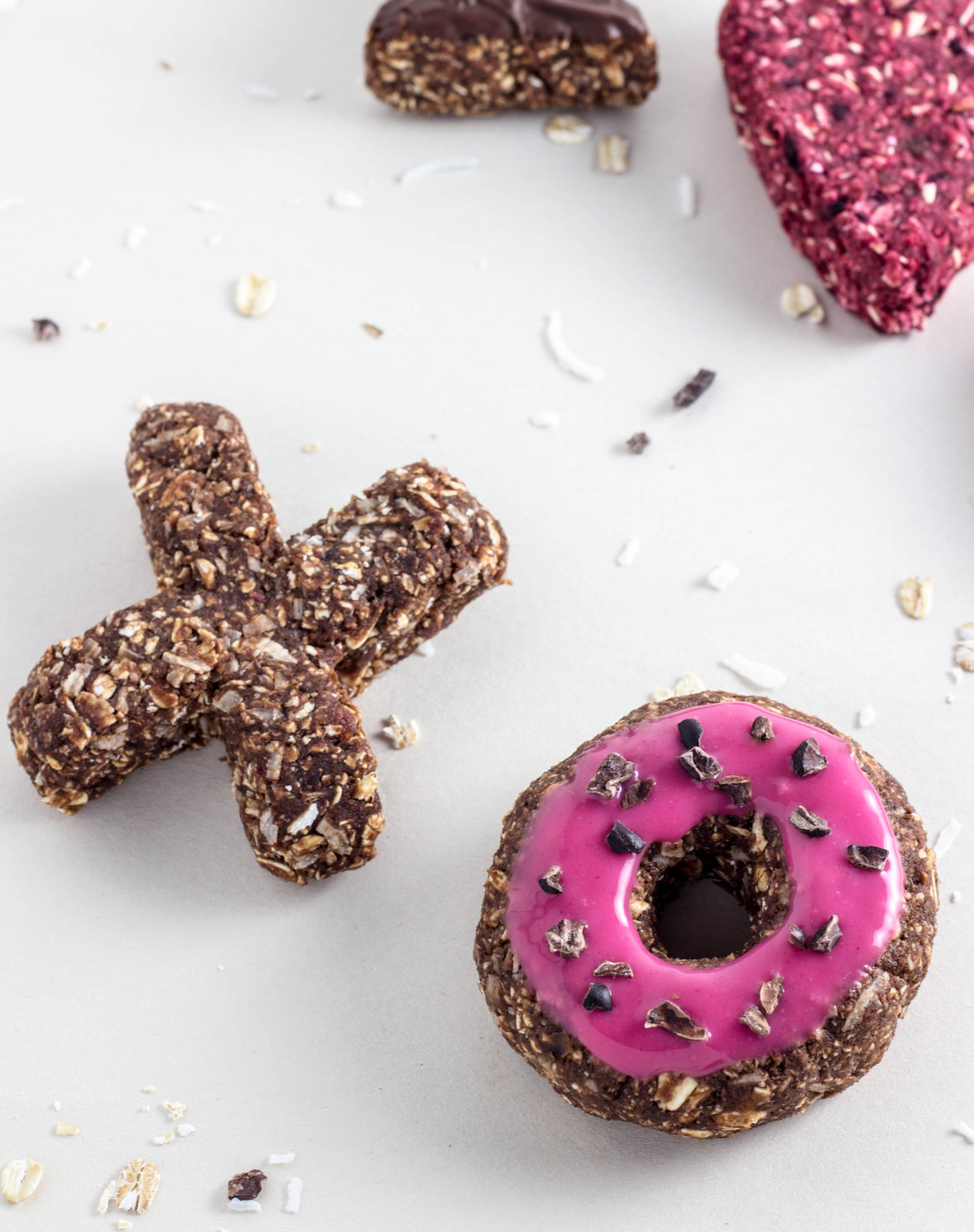 Vegan Raw Doughnuts-Made with grated beet for a festive pink, loads of nutrition, and of course chocolate for a decadent treat. So simple to make. 