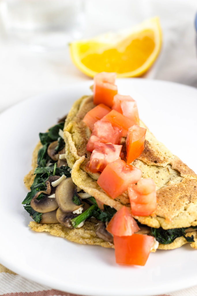 Vegan Chickpea Flour Omelette-Eggs aren’t the only way to get protein in the morning. This Vegan Chickpea Flour Omelette packs as much protein as an egg and tastes just as delicious. Filled with veggie goodness so it’s hearty and filling. A great way to start the day! 