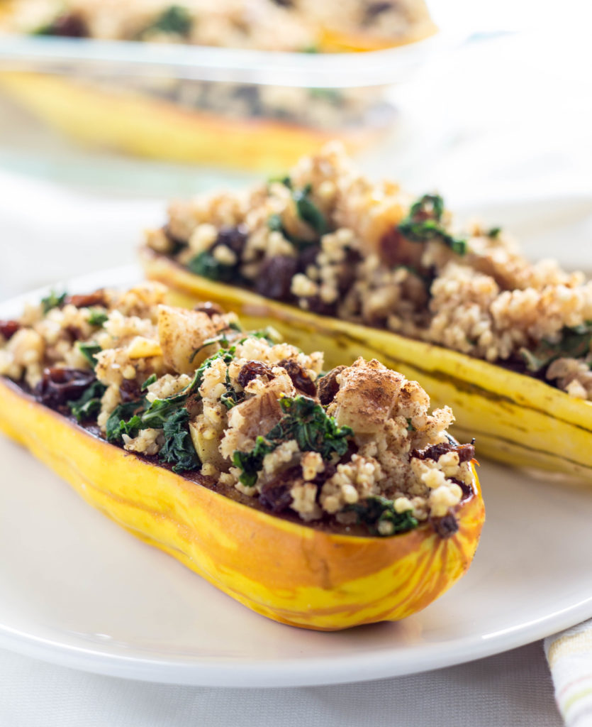 Millet Stuffed Delicata Squash-made with apples, kale, raisins, cinnamon and more for a ton of delicious flavor. A meal the whole family will love.