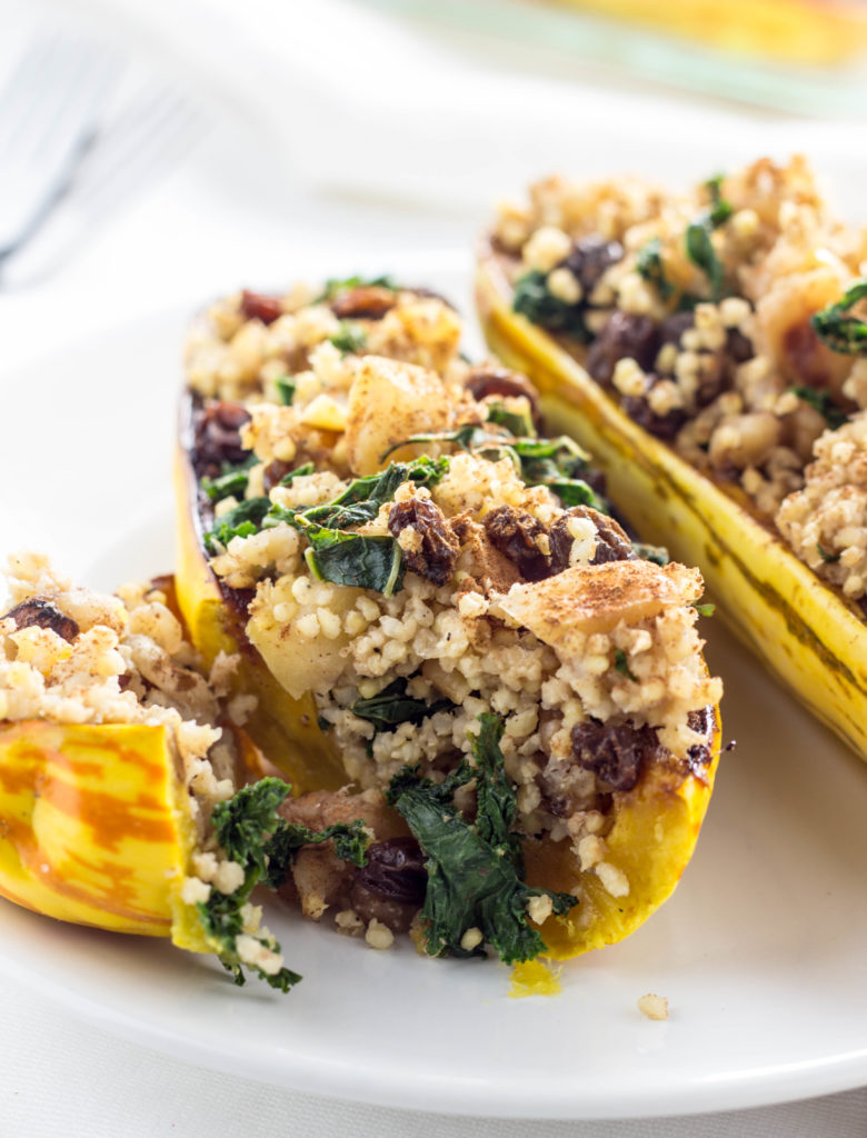 Millet Stuffed Delicata Squash-made with apples, kale, raisins, cinnamon and more for a ton of delicious flavor. A meal the whole family will love.