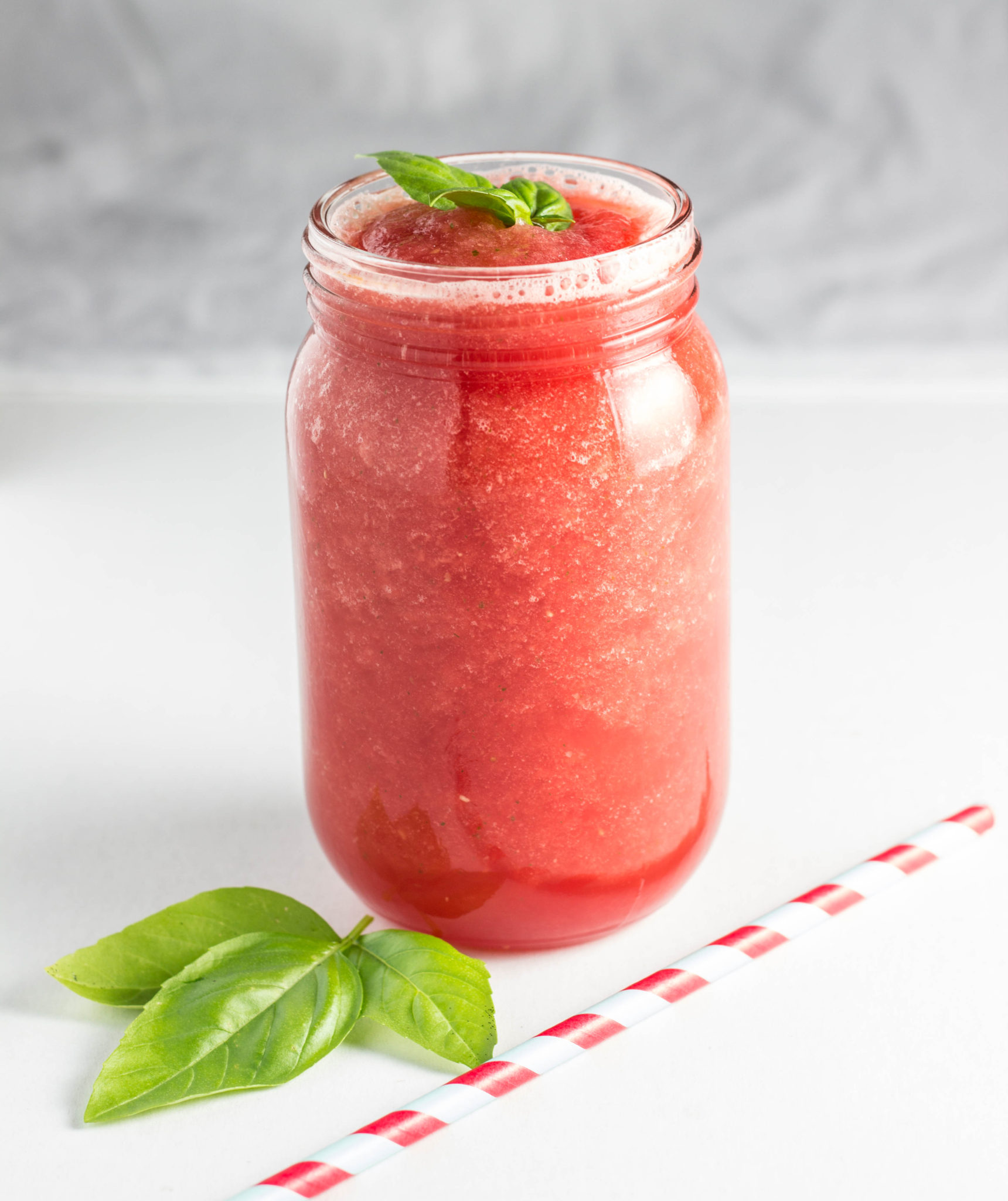 Watermelon Basil Smoothie against a white background. 