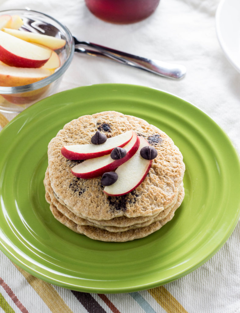 Whole Wheat Vegan Chocolate Chip Pancakes- Super simple, fluffy, and a family favorite. Made with 9 ingredients and ready in less than 30 minutes.