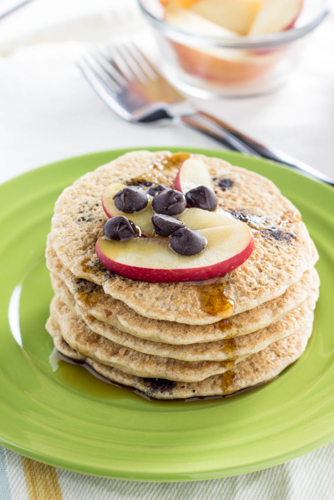 Whole Wheat Vegan Chocolate Chip Pancakes- Super simple, fluffy, and a family favorite. Made with 9 ingredients and ready in less than 30 minutes.