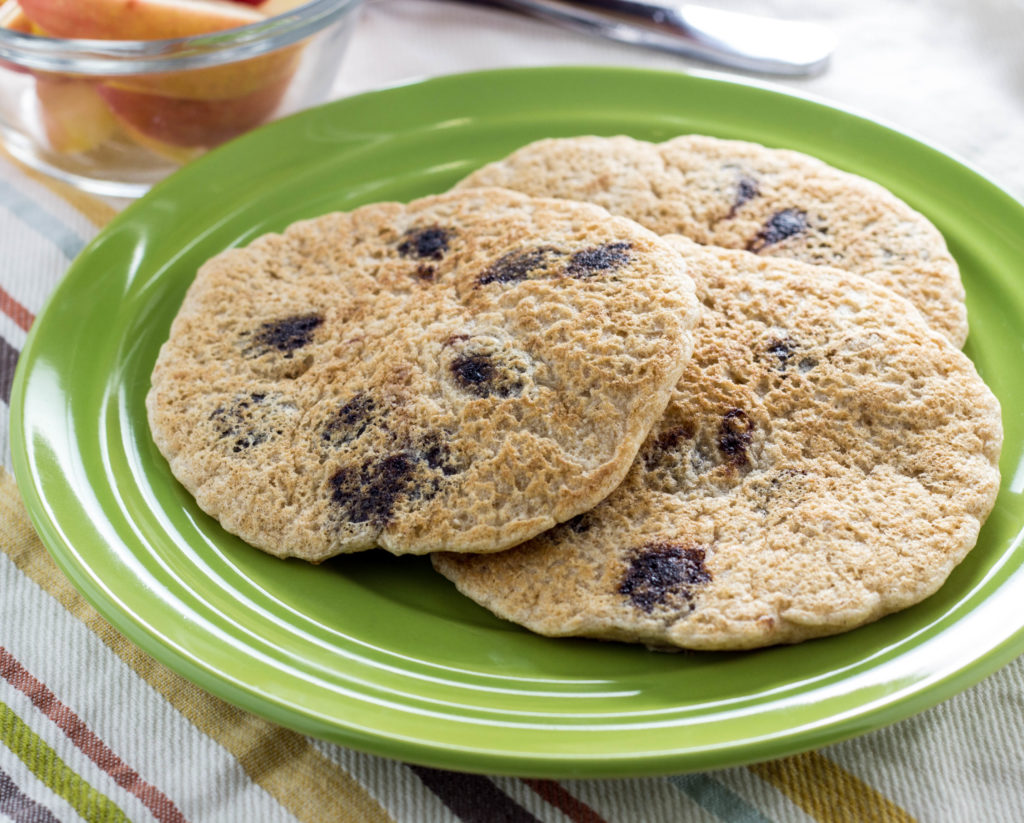 Whole Wheat Vegan Chocolate Chip Pancakes- Super simple, fluffy, and a family favorite. Made with 9 ingredients and ready in less than 30 minutes.