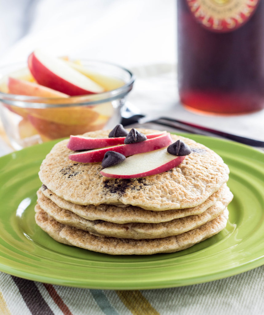 Whole Wheat Vegan Chocolate Chip Pancakes- Super simple, fluffy, and a family favorite. Made with 9 ingredients and ready in less than 30 minutes.