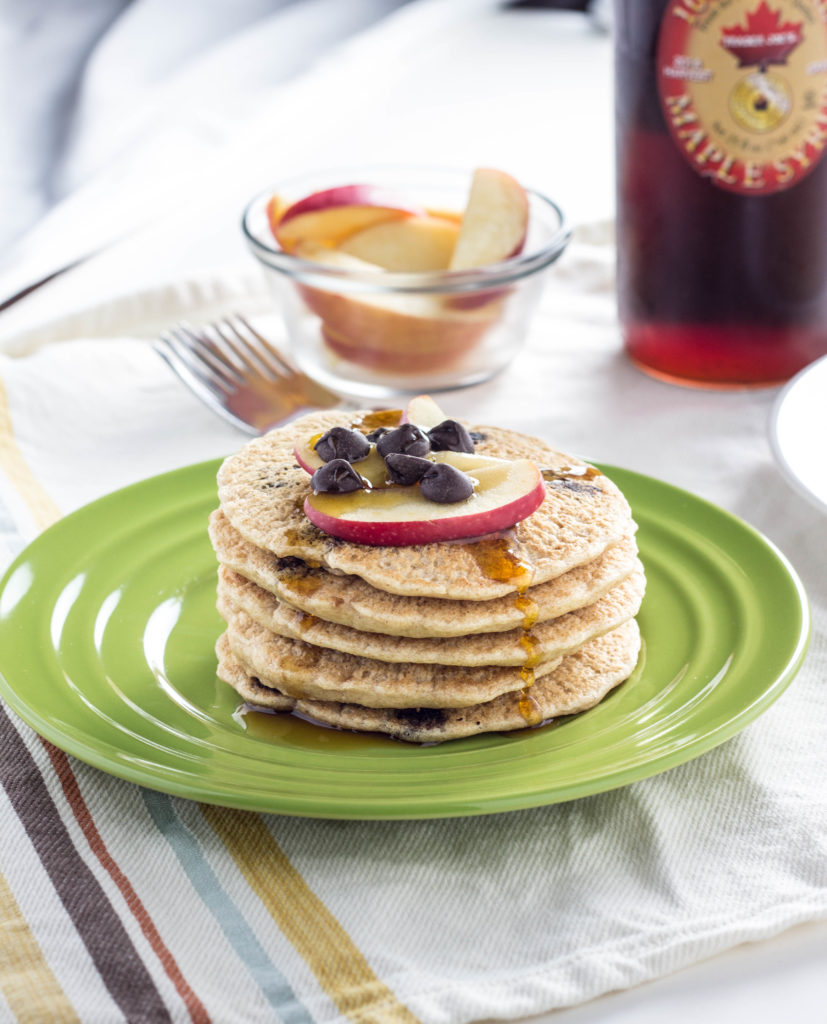 Whole Wheat Vegan Chocolate Chip Pancakes- Super simple, fluffy, and a family favorite. Made with 9 ingredients and ready in less than 30 minutes.