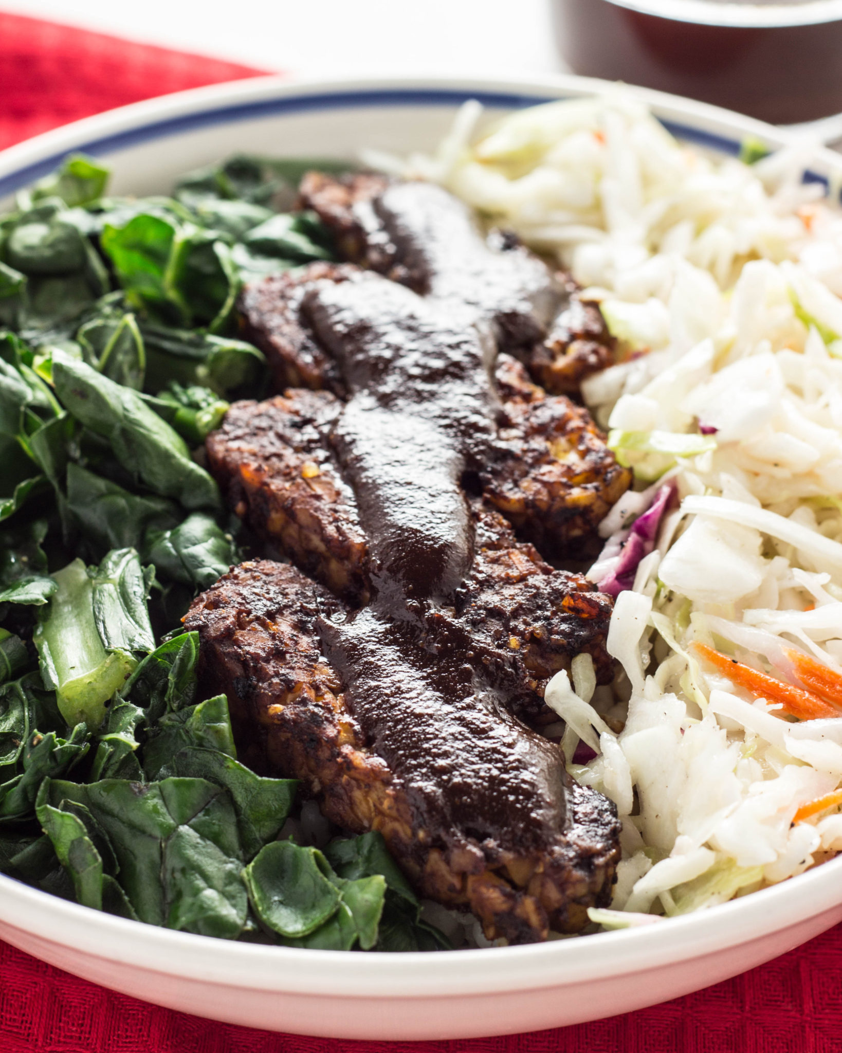 Vegan BBQ Tempeh Bowl with coleslaw and collard greens 