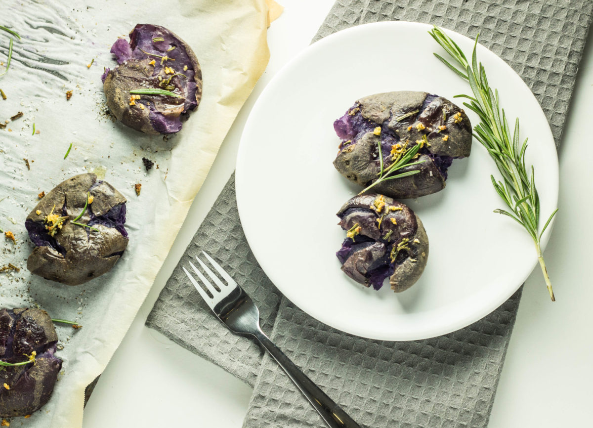 Top view of Garlic Rosemary Smashed Purple Potatoes.