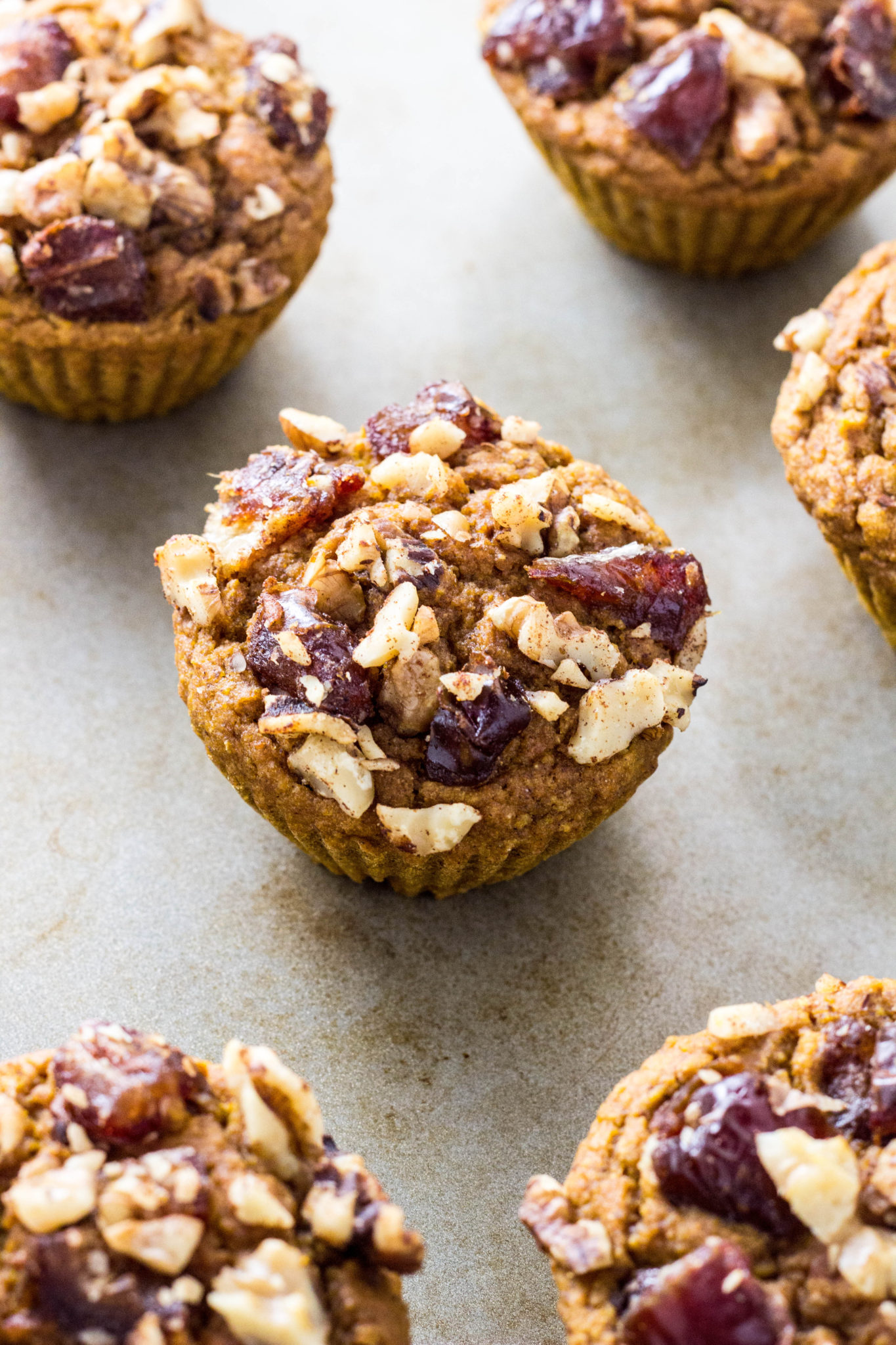 Top forty five degree angle view of muffin with other muffins around. 