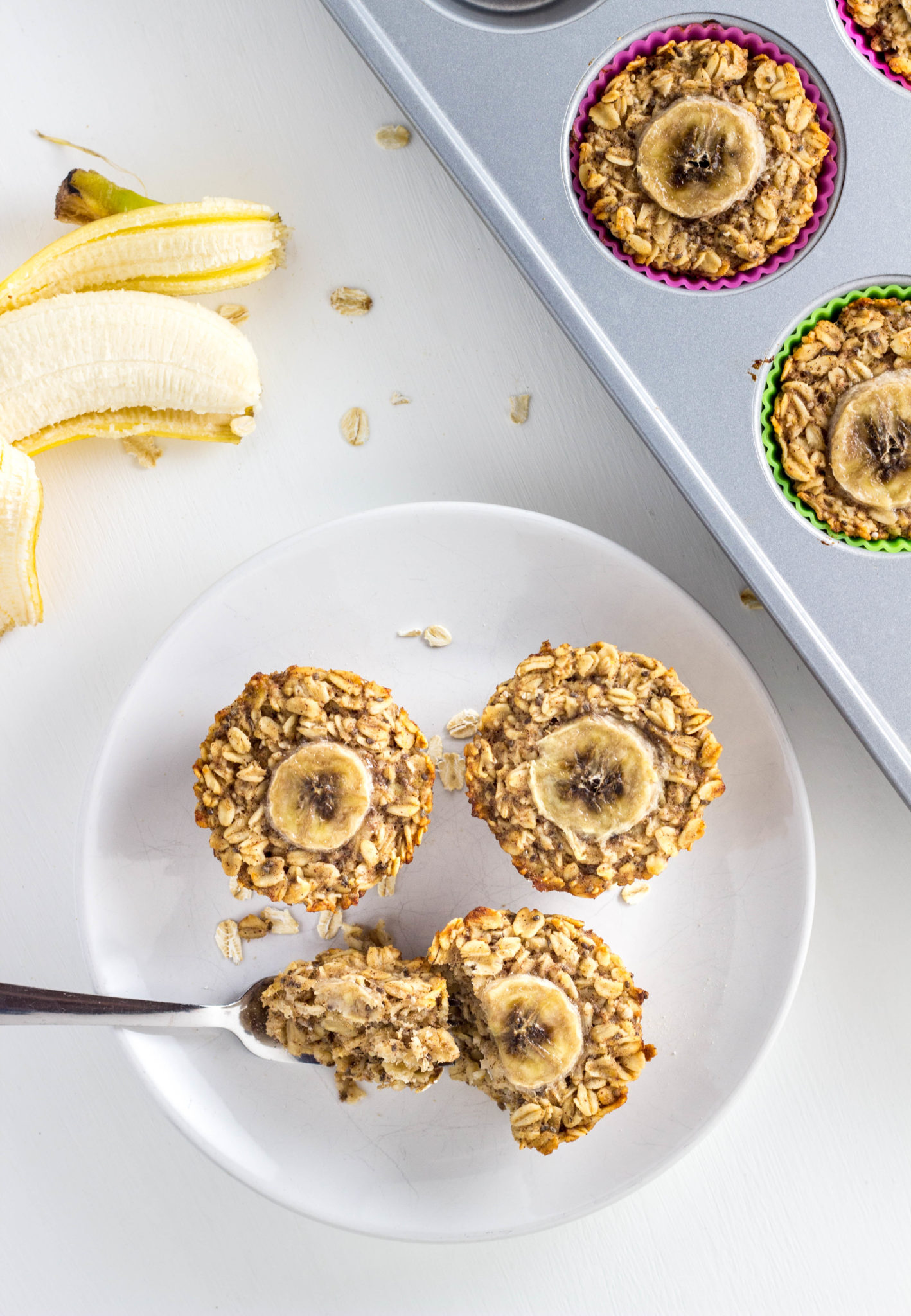 Top view of Vegan Banana Bread Baked Oatmeal Cups on a white plate. 