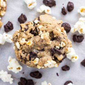 Top view of Vegan Movie Snack Cookies with popcorn and chocolate covered raisins around.