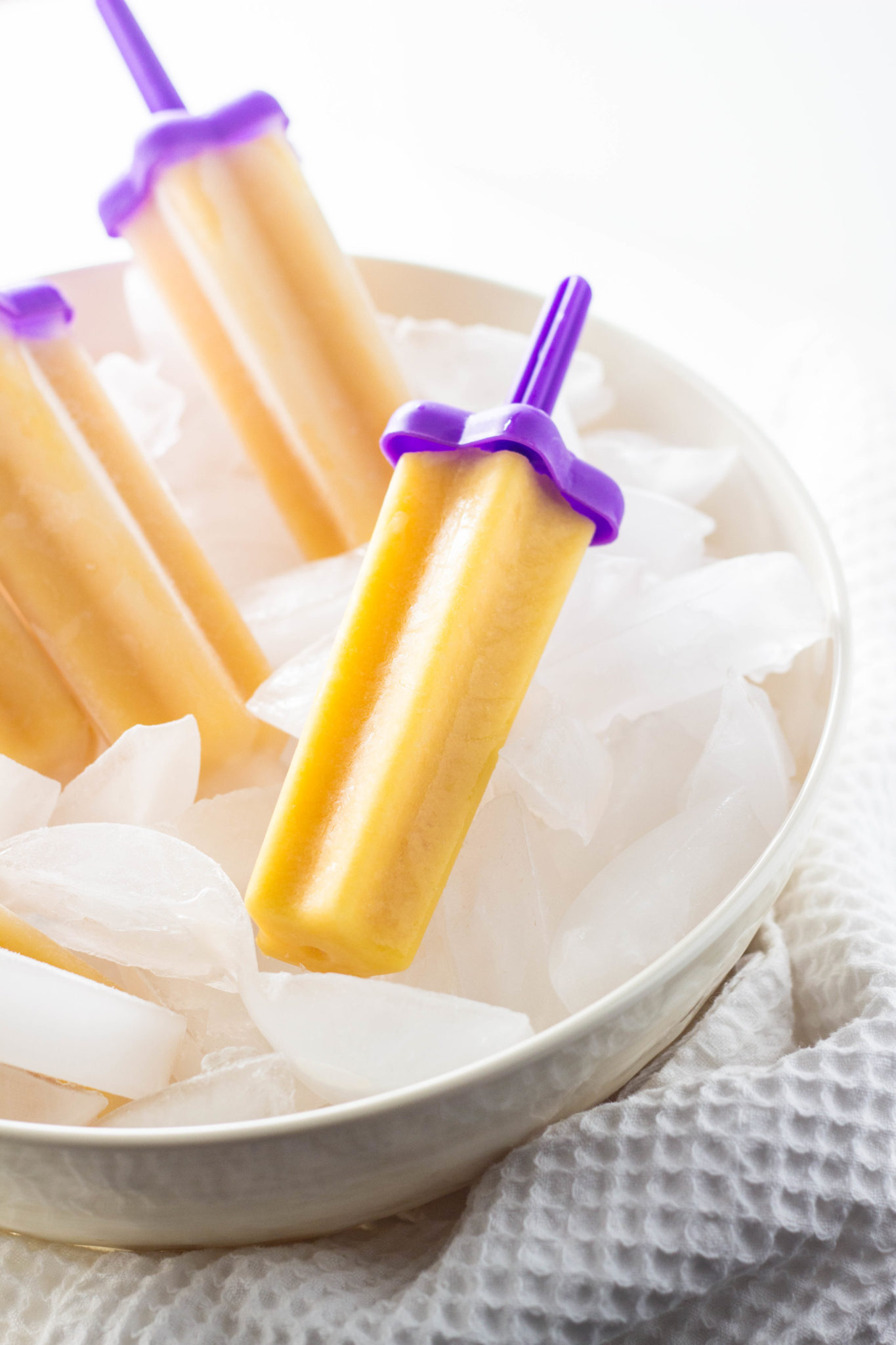 Close up of freezer pops in a large bowl of ice. 