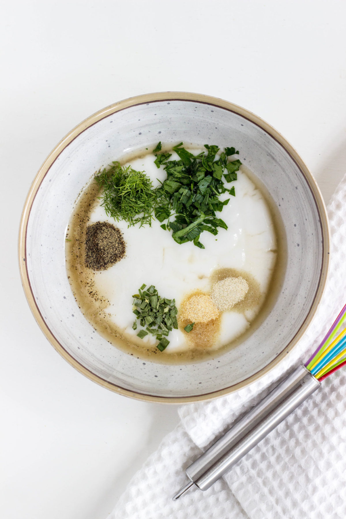 Ingredients for dressing in a small bowl before whisking together. 