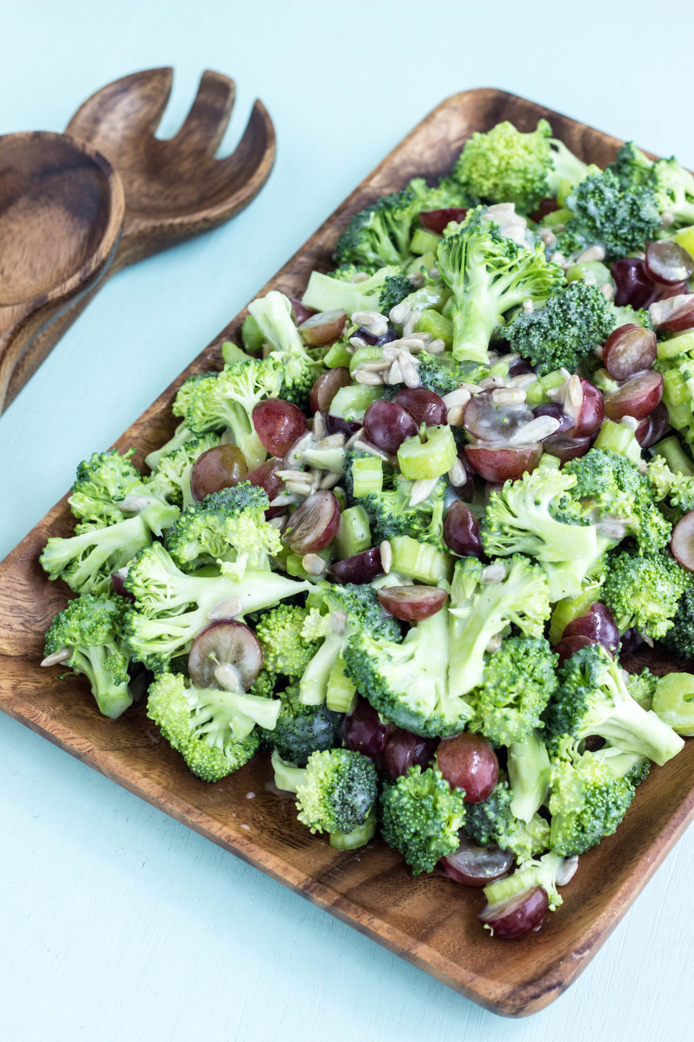 Vegan Broccoli Grape Salad in a wooden serving dish. 