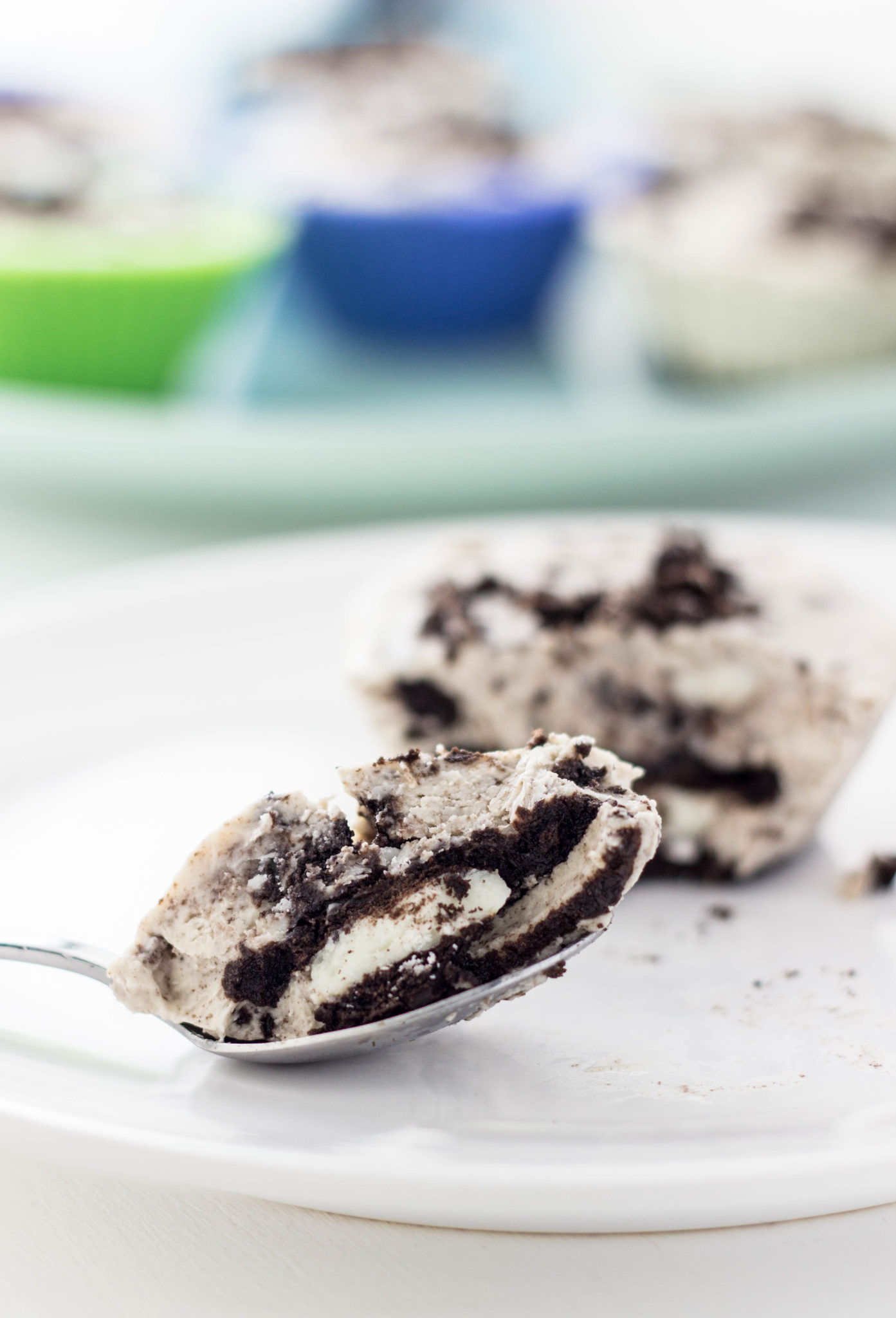 Close up of a spoon with a bite of an ice cream cup.