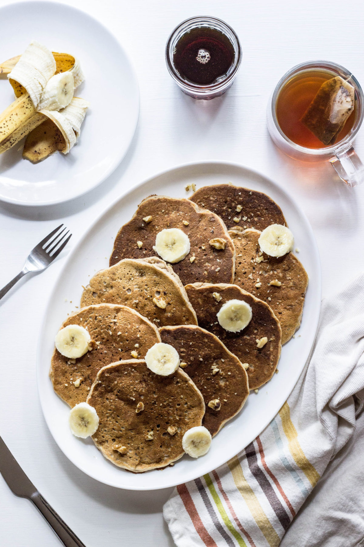 Whole Wheat Banana Nut Pancakes platter, top view. Vegan Mother's Day Brunch Recipes. 