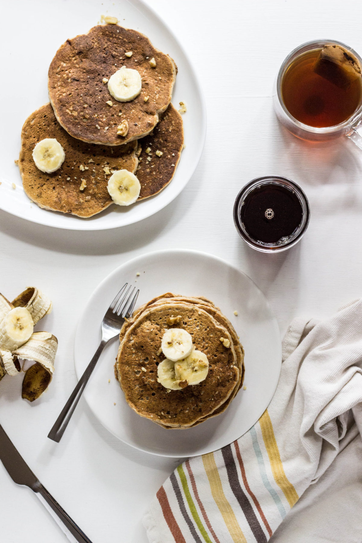 Overhead view of Whole Wheat Banana Nut Pancakes stacked.