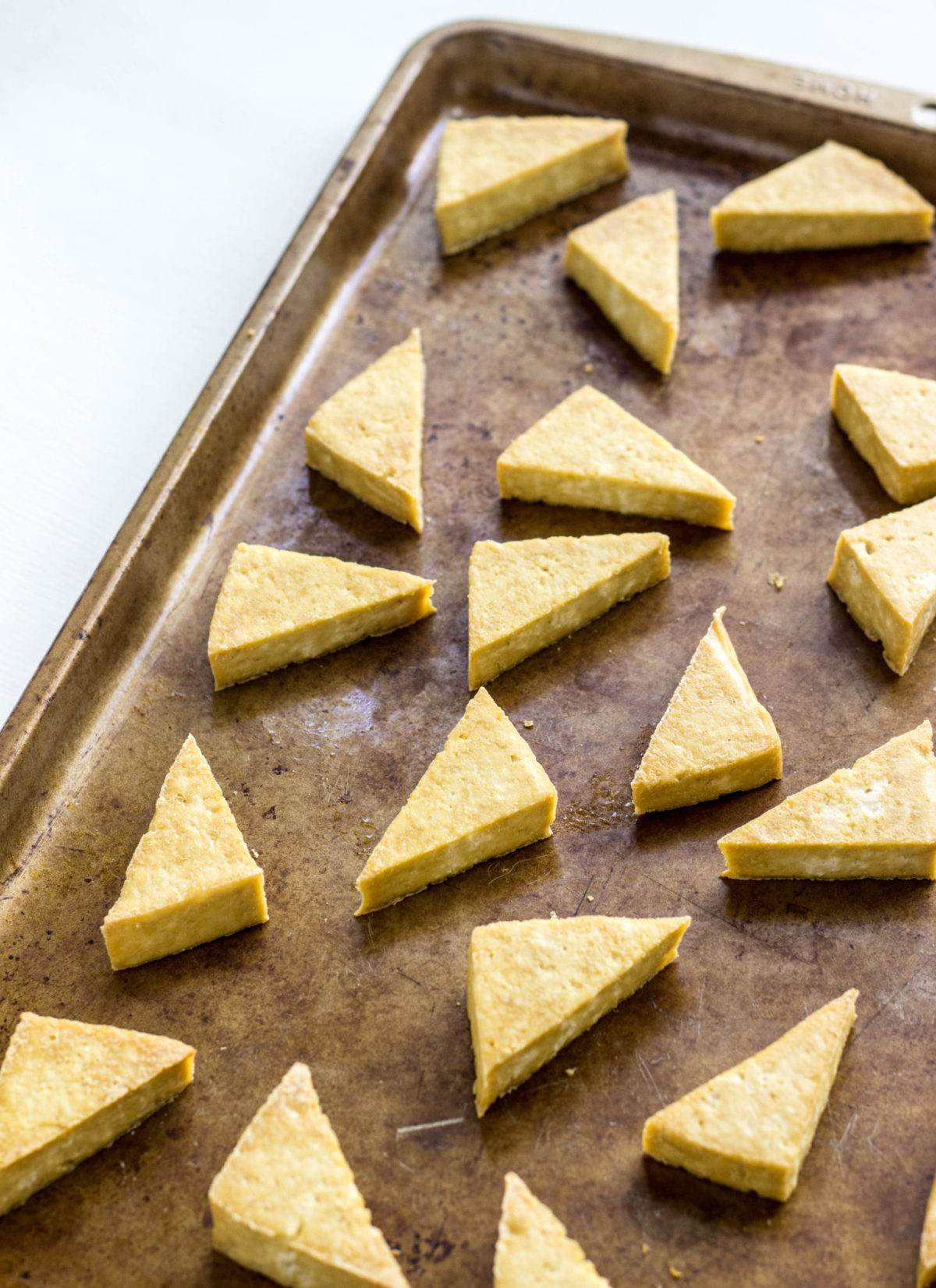 Tofu wedges on a baking sheet