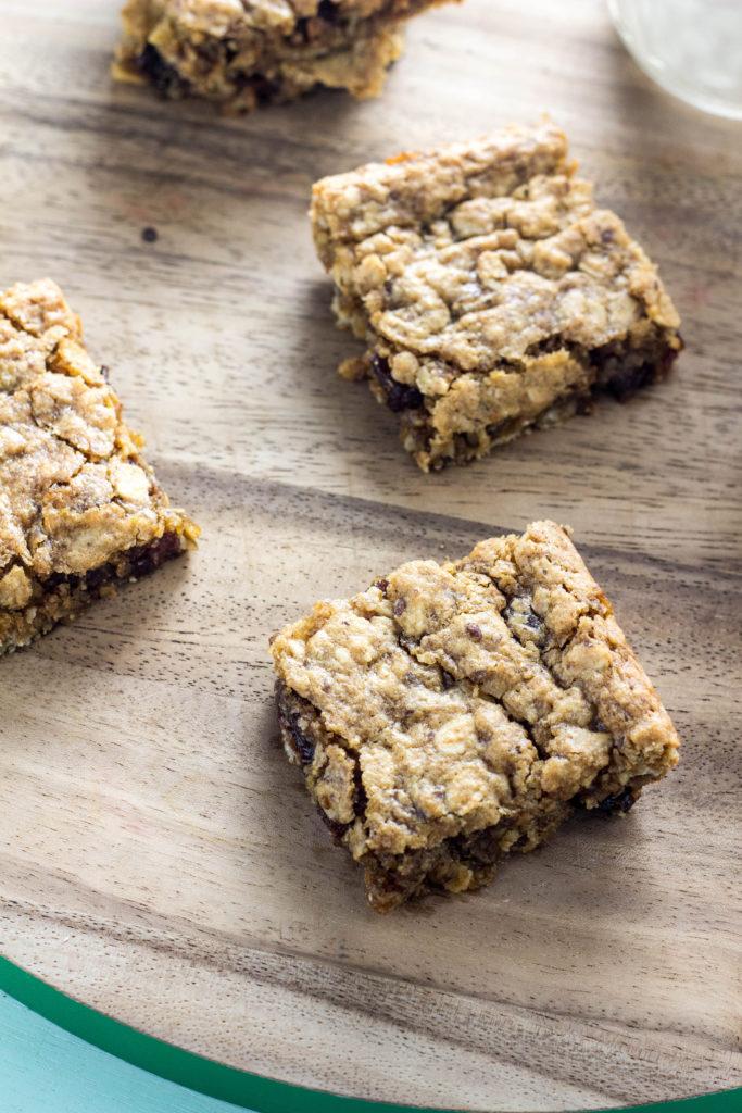 Peanut Butter Oatmeal Raisin Cookie Bars on a wood board 