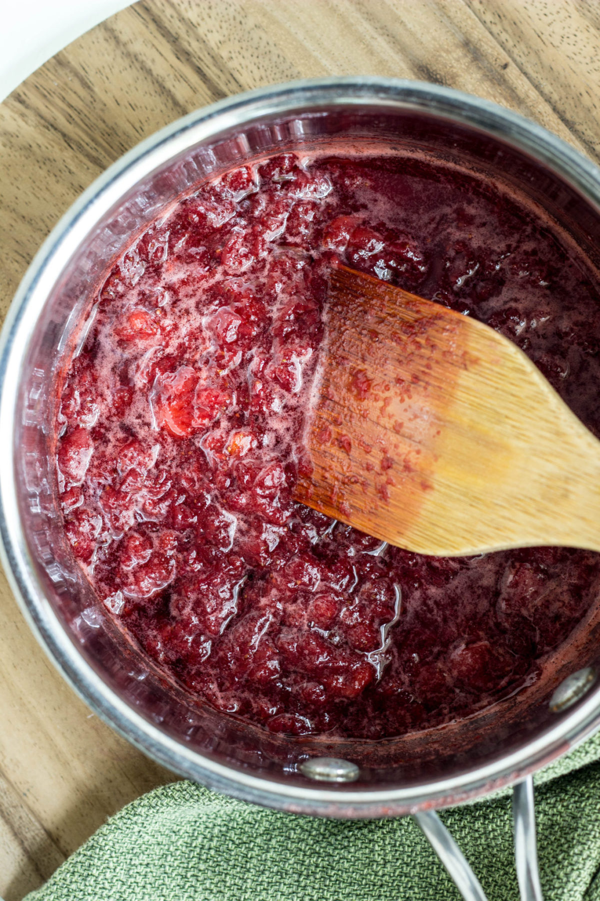 Top view of prepared strawberry sauce in pot.