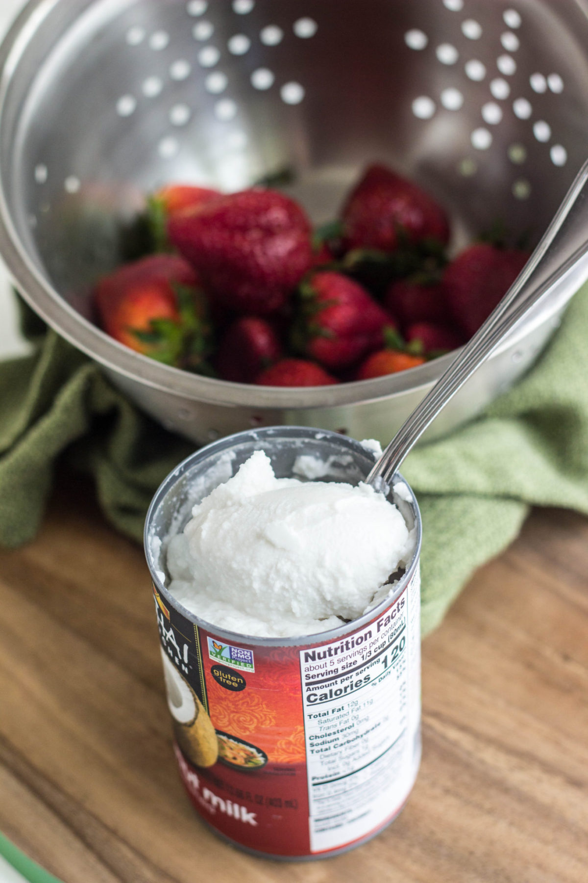 Side view of can of coconut milk cream being scooped