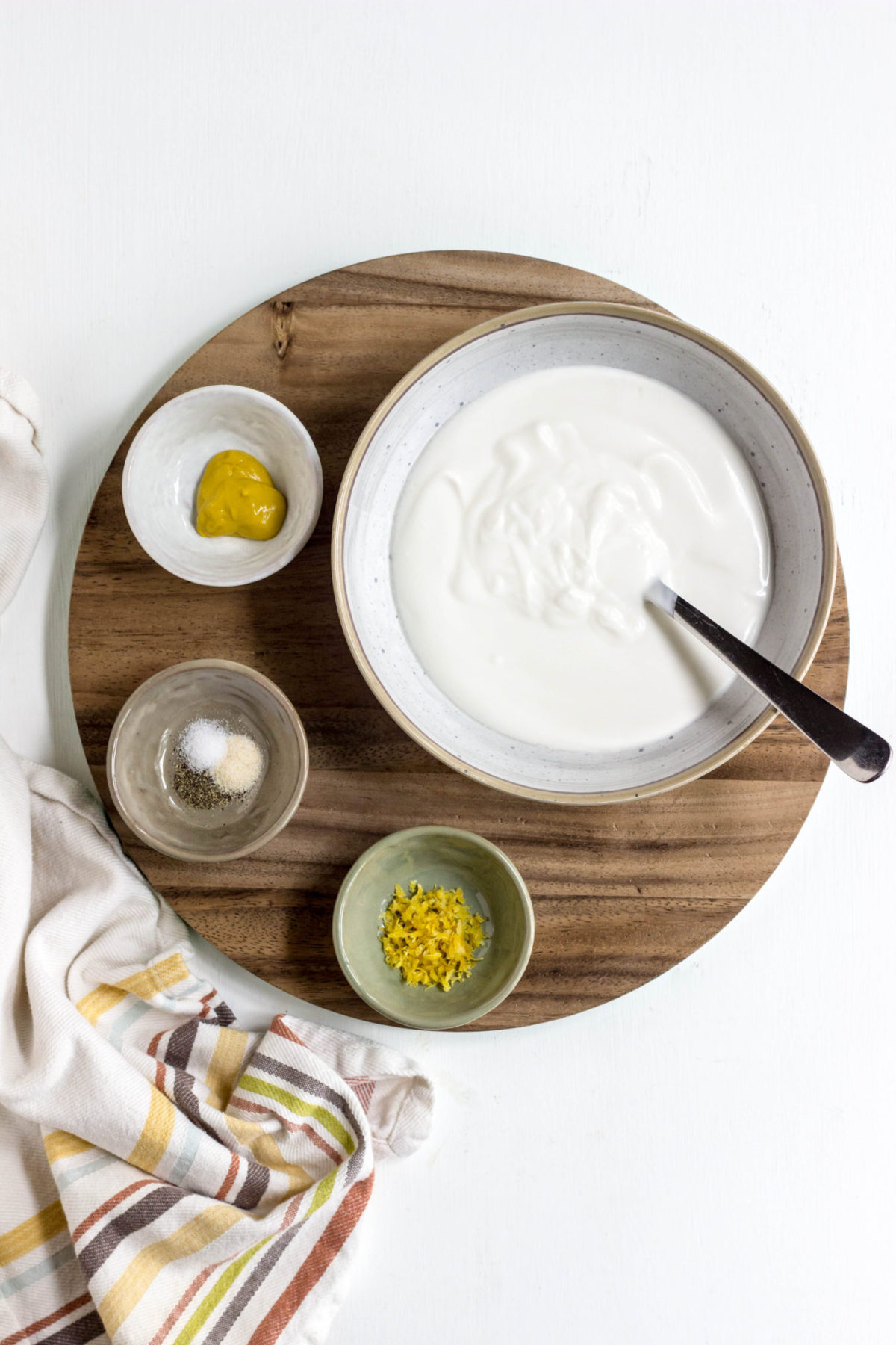 Top view of Ingredients used to make a yogurt dressing for chickpea salad. 