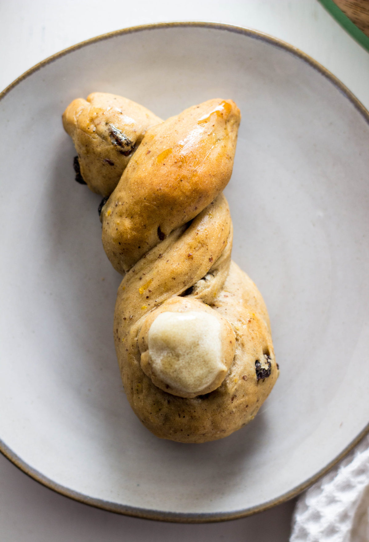 Close up of hot cross bunny on a plate, top view. 