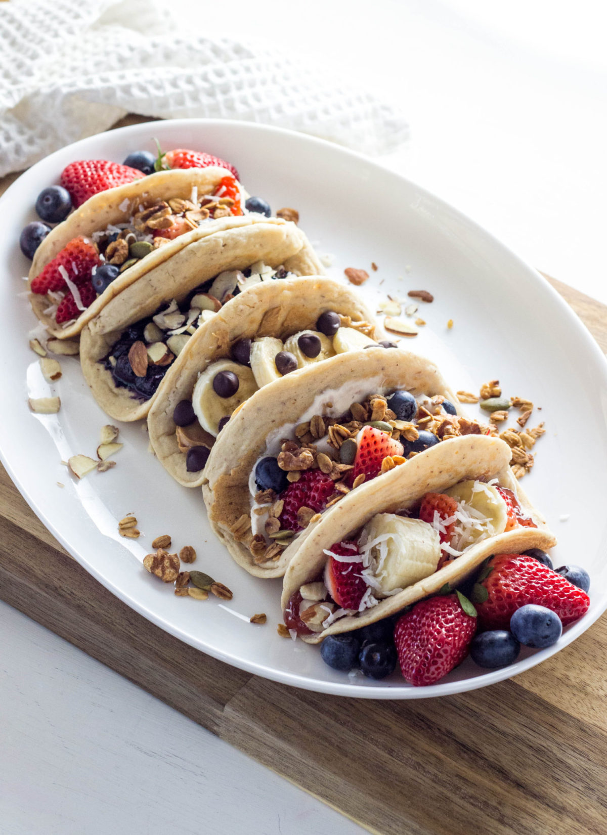 Side view of Vegan Almond Pancake Taco with different fillings and toppings. . 