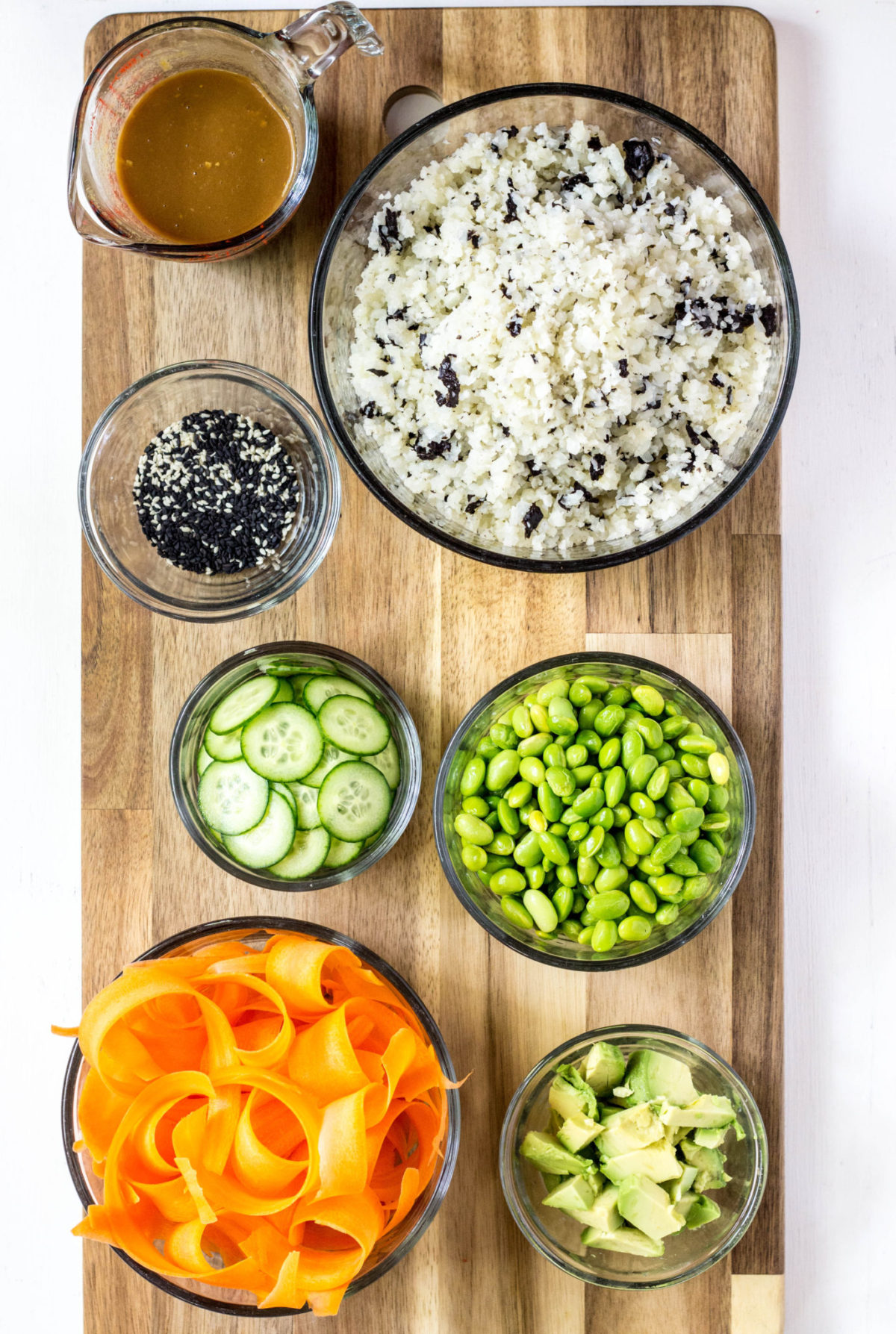 Ingredients used to assemble Vegan Grain Free Sushi Bowl on a wooden board. 