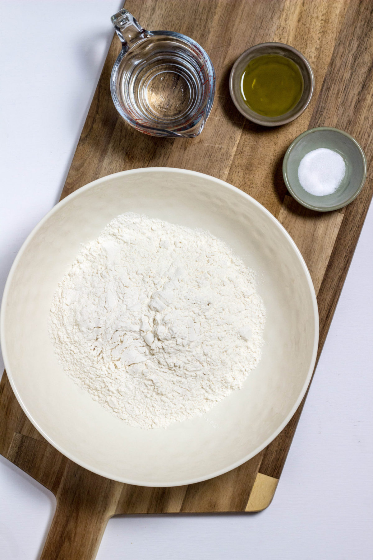 Top view of Ingredients for Easy Flatbread on a wooden board. 