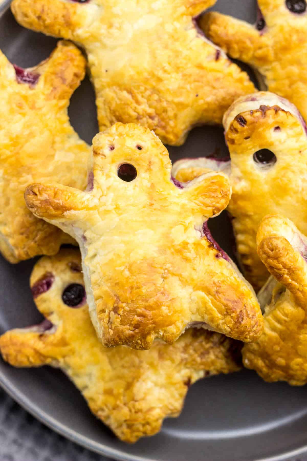 Top view close up of Boo Berry Hand Pies on a gray plate.