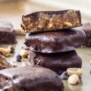 Close up of a stack of Vegan Peanut Butter Snickers Bites.