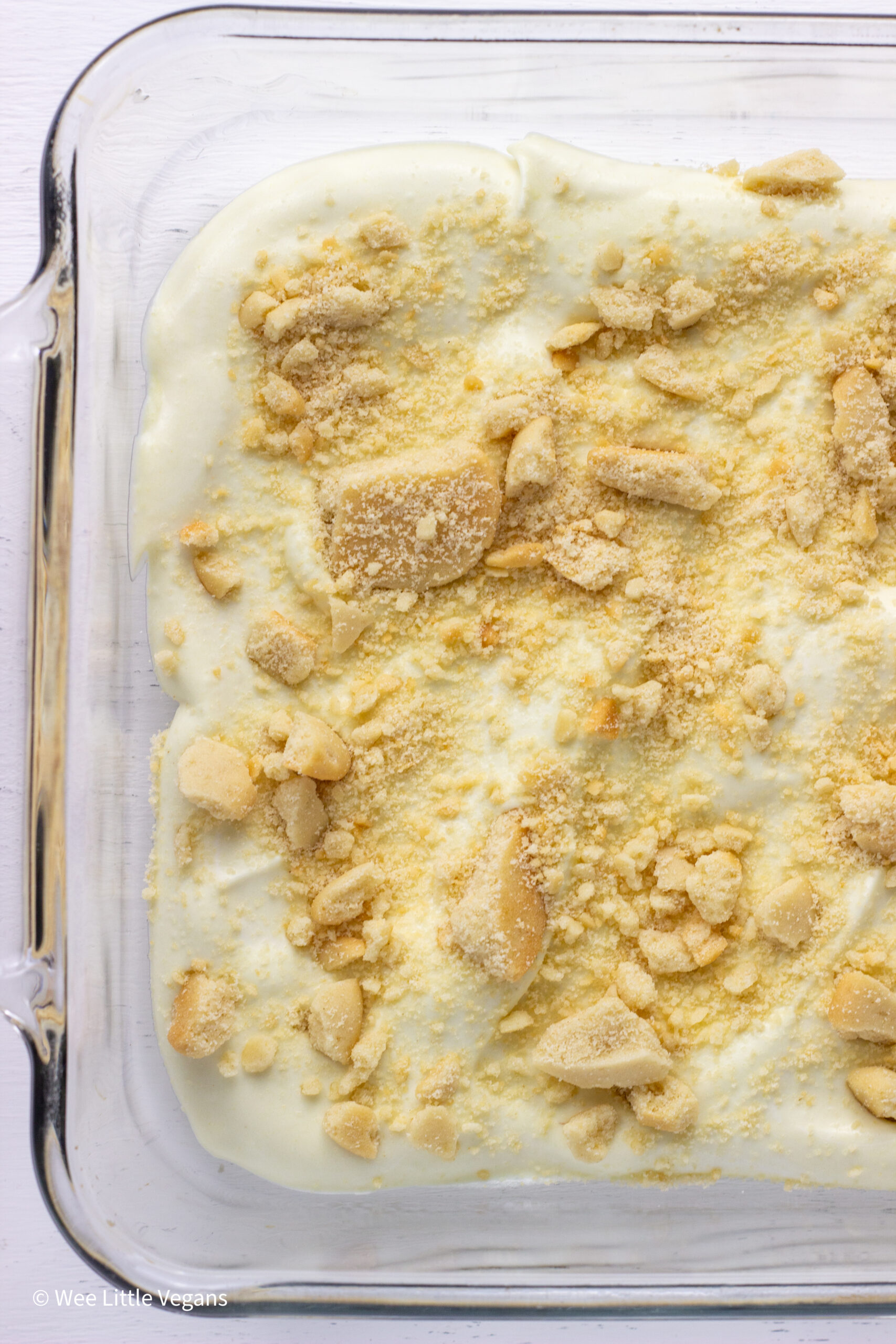 Overhead shot of vegan banana pudding topped with crushed vanilla wafers.