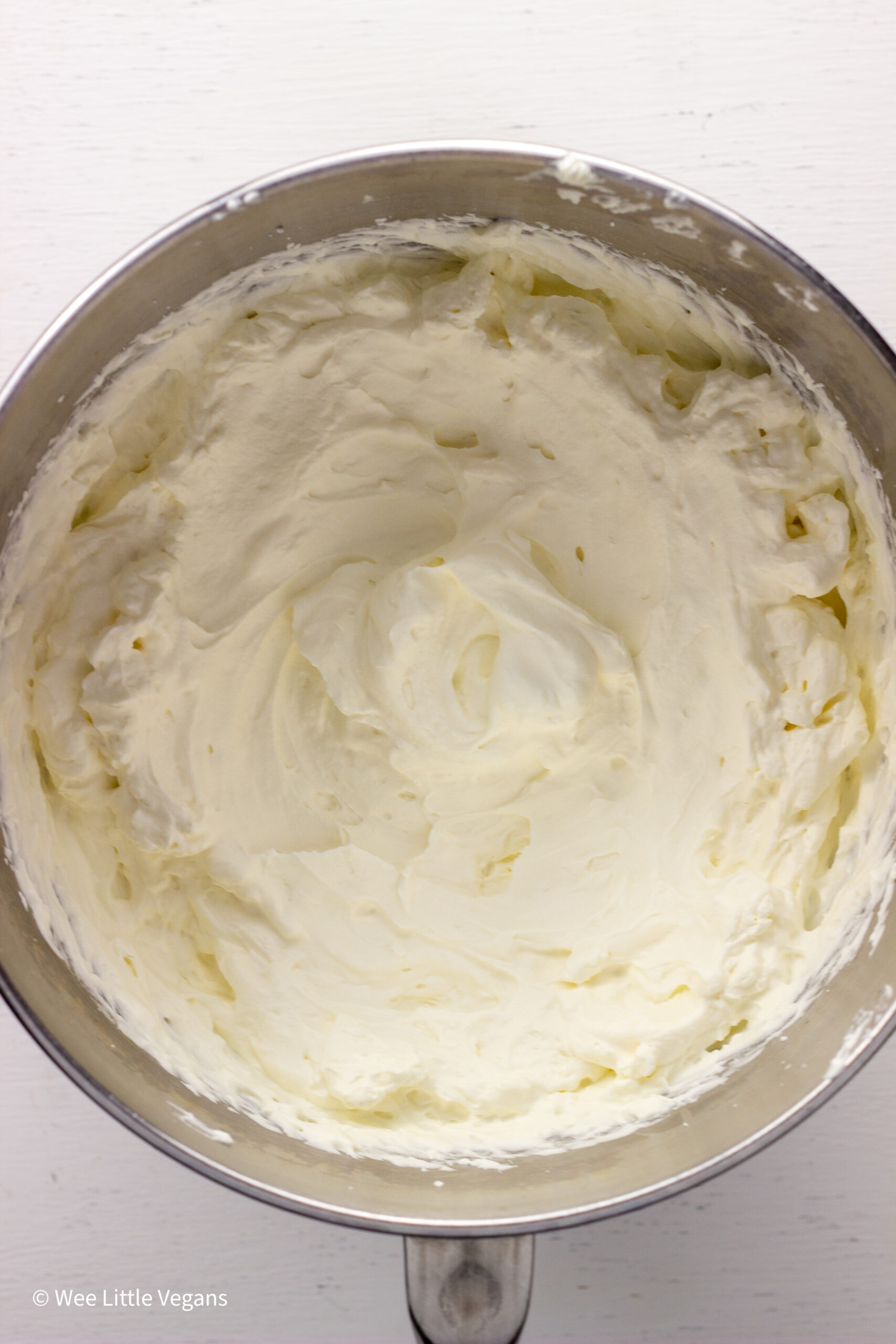 Overhead shot of non dairy whipped cream in a mixing bowl.