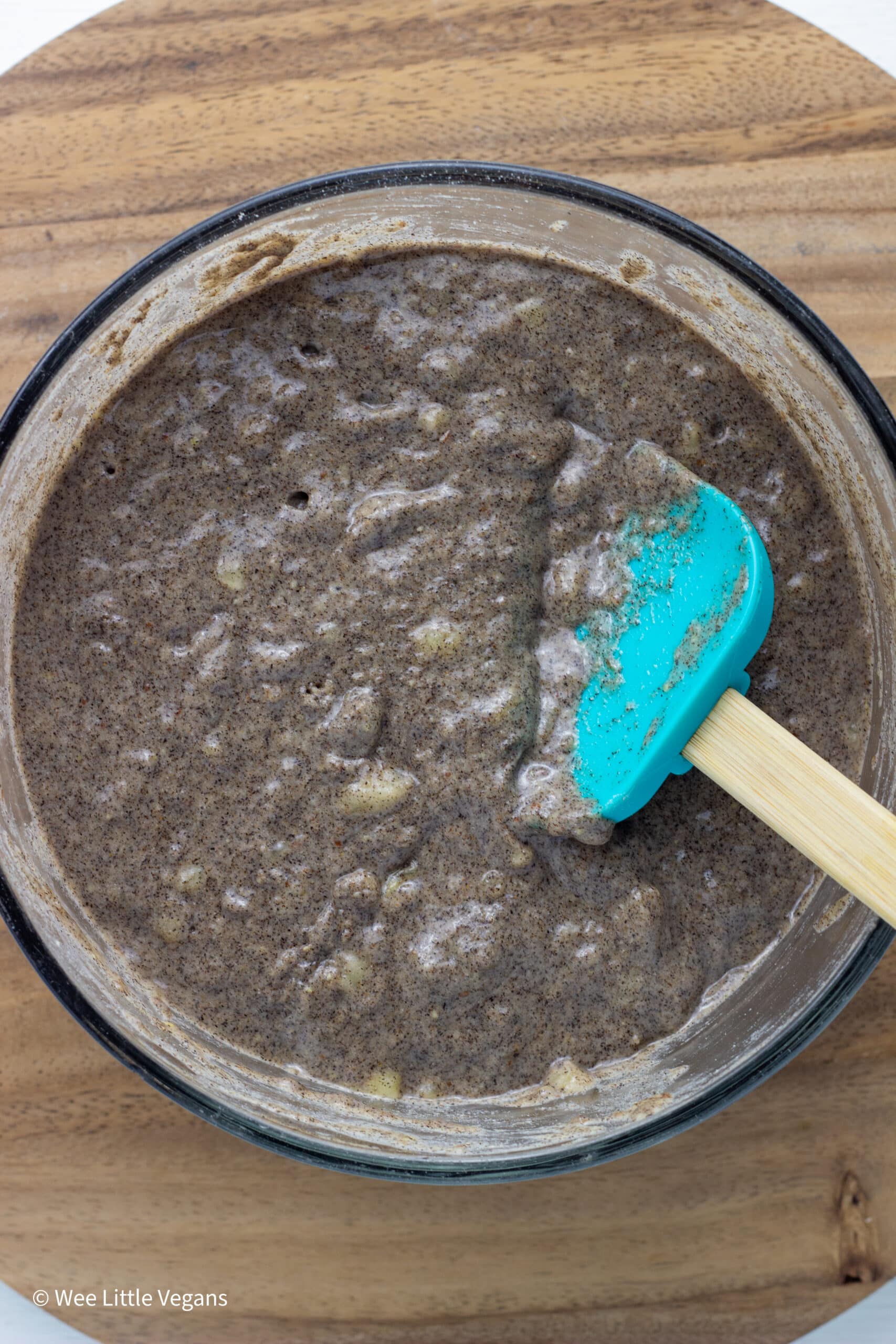 Overhead close up of muffin batter in a bowl.