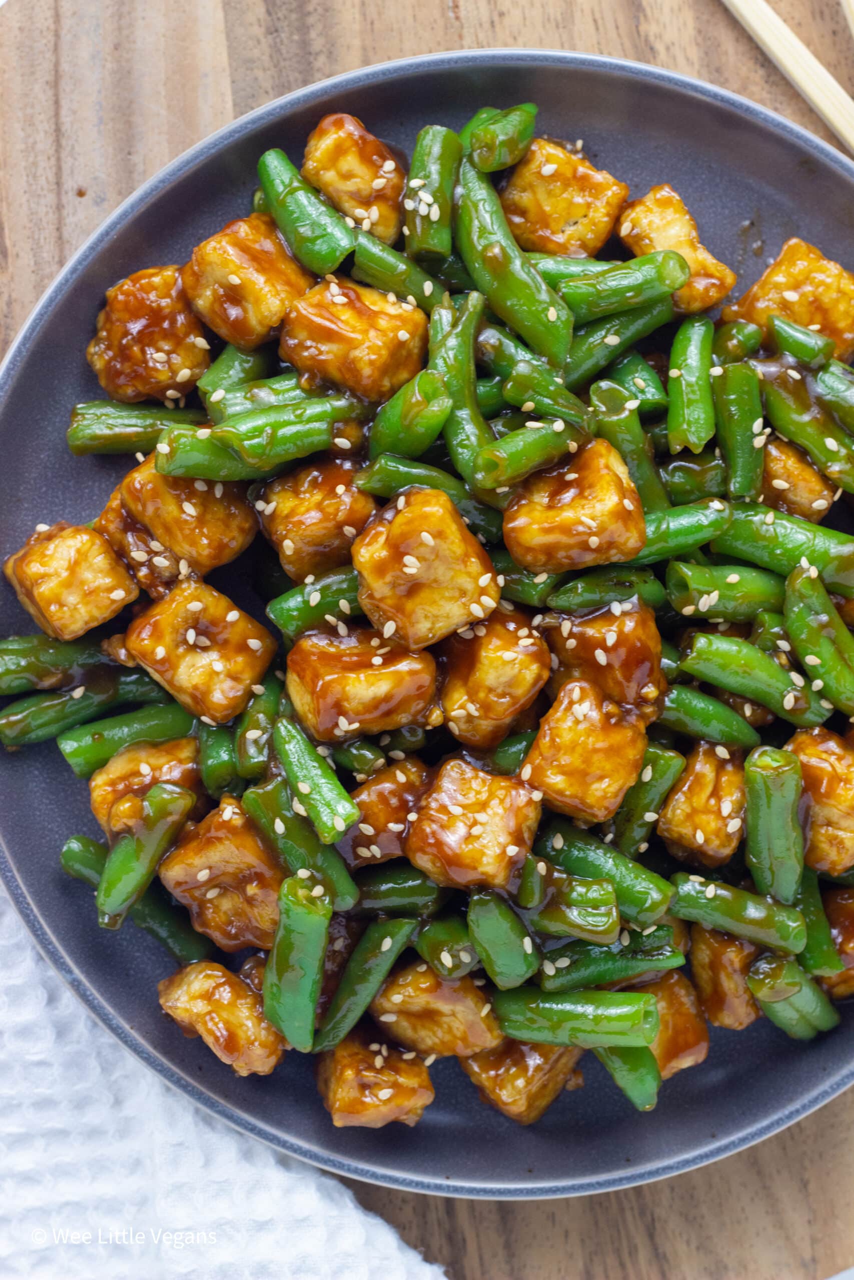 Overhead shot of Hoisin Tofu and Green Beans on a gray plate.