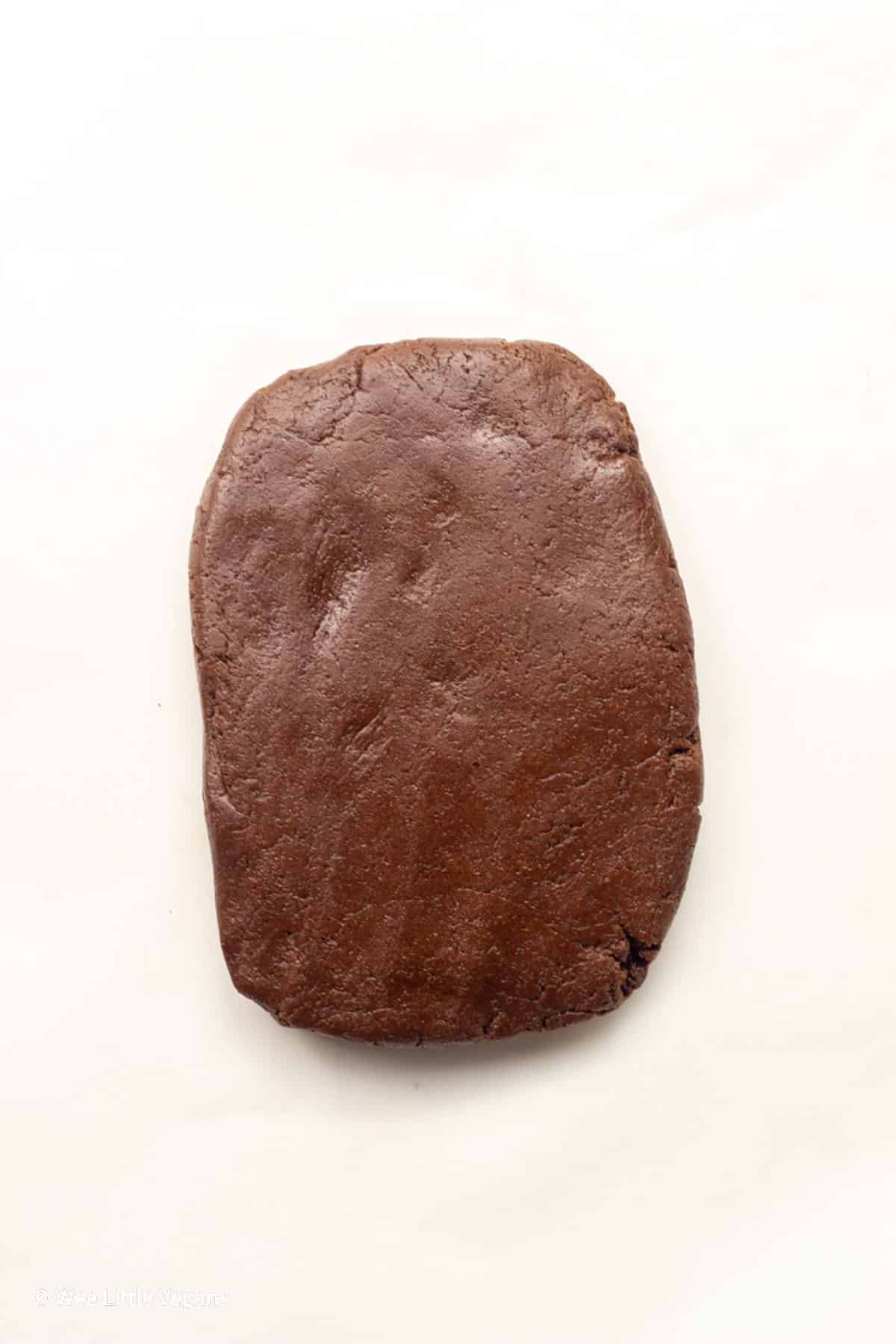 Overhead shot of Spiced Chocolate Cut Out Cookie dough on a piece of parchment paper.