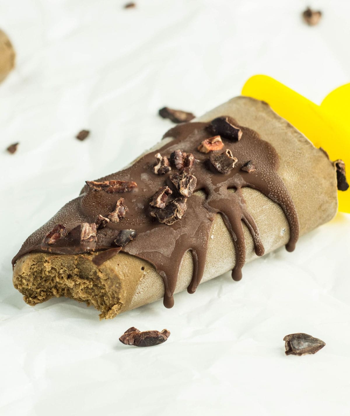 Close up of Avocado Fudge Pop with a bite taken.