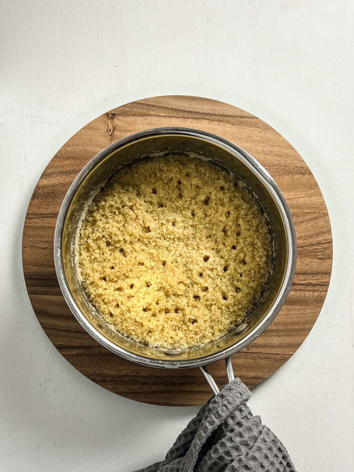 Overhead shot of cooked quinoa in a saucepan.