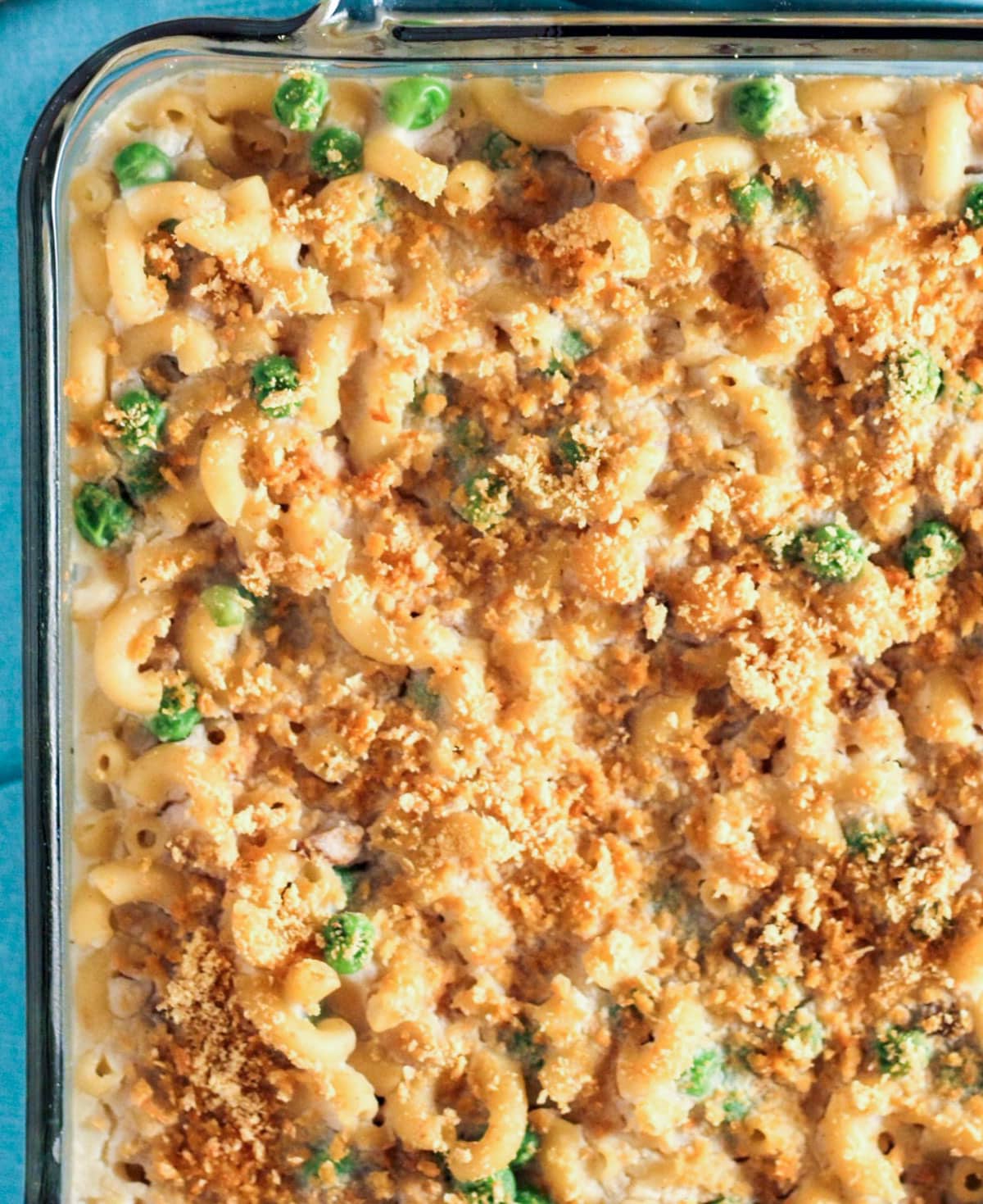 Overhead close up view of Vegan Chickpea Noodle Casserole in a baking dish.