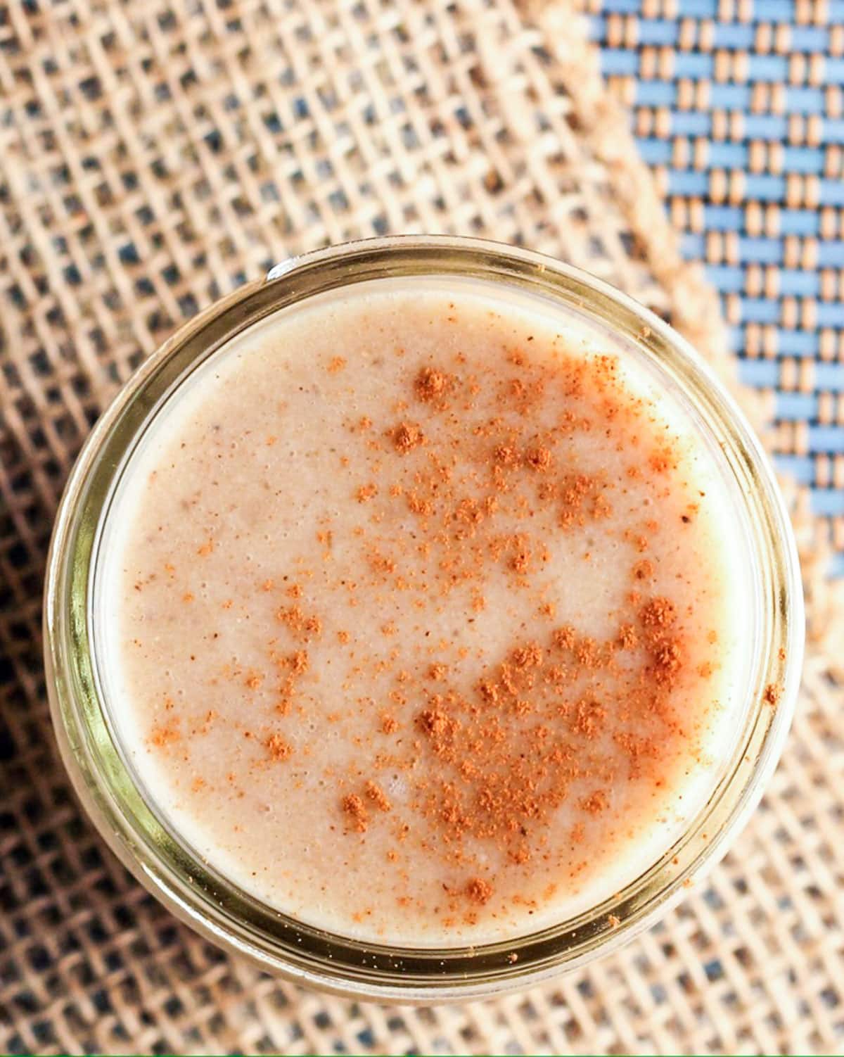 Close up, top down view of a glass of Vegan EggNog.