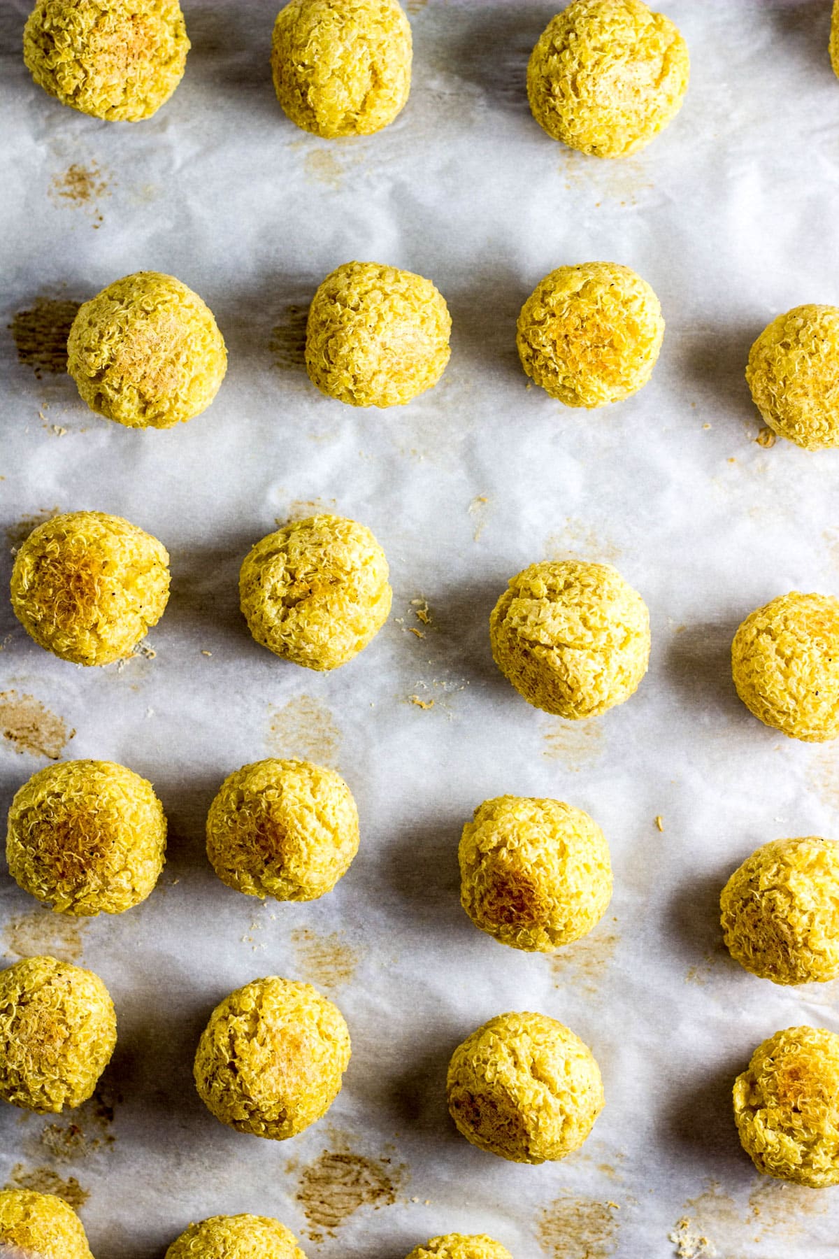 Overhead shot of Vegan Barbecue Quinoa Ball Sliders on a baking sheet after baking.