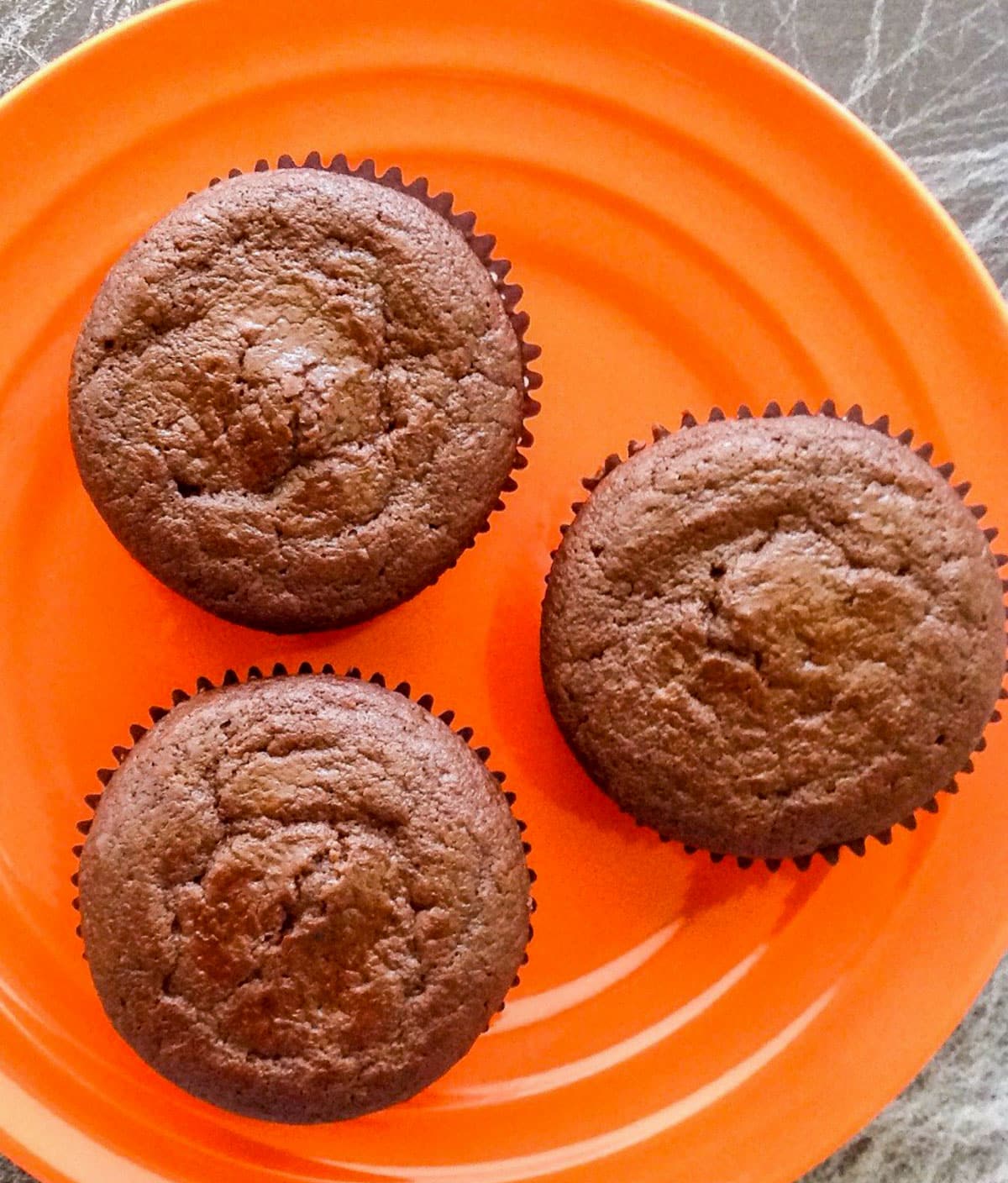 Overhead close up view of Vegan Chocolate Cupcakes without frosting.