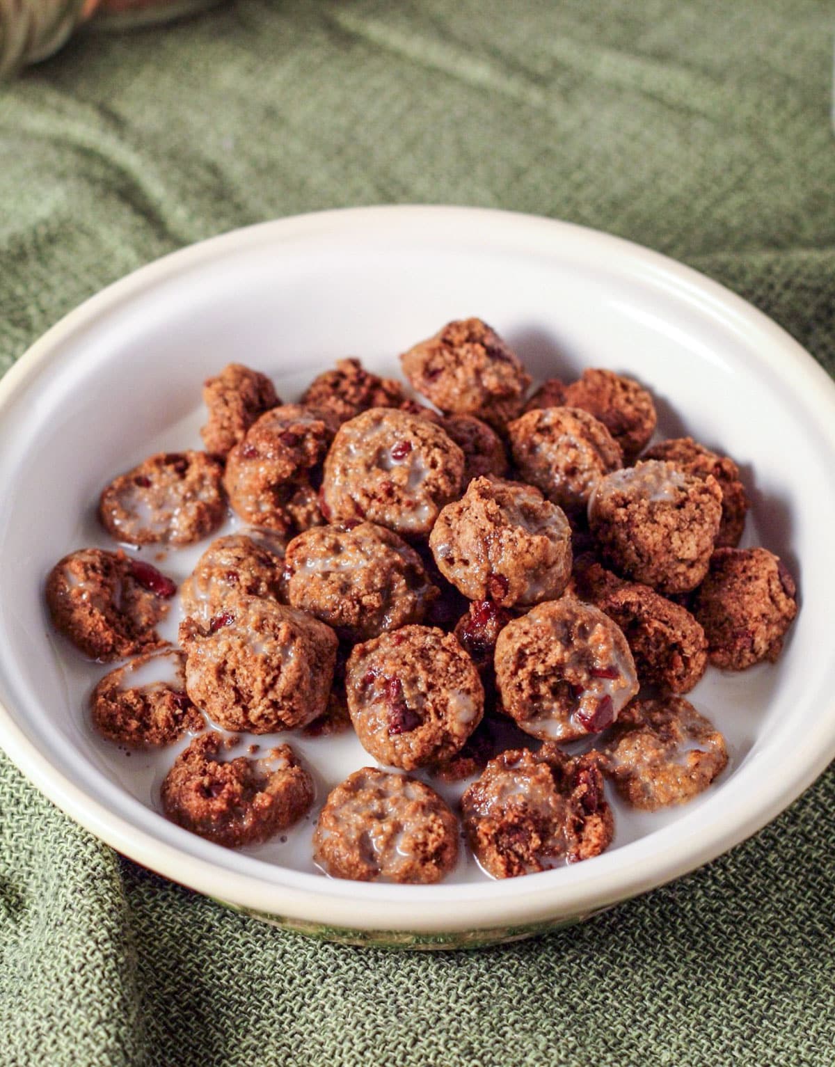 A small bowl of Healthy Cookie Crisp Cereal with non dairy milk.