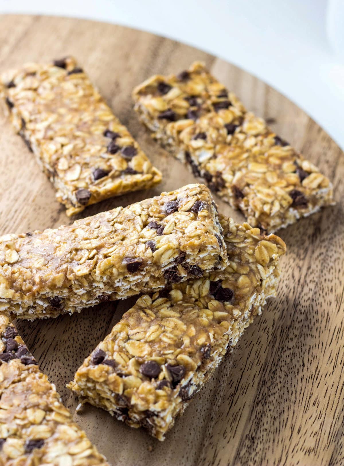 Peanut Butter Chocolate Chip Granola Bars on a wooden board.