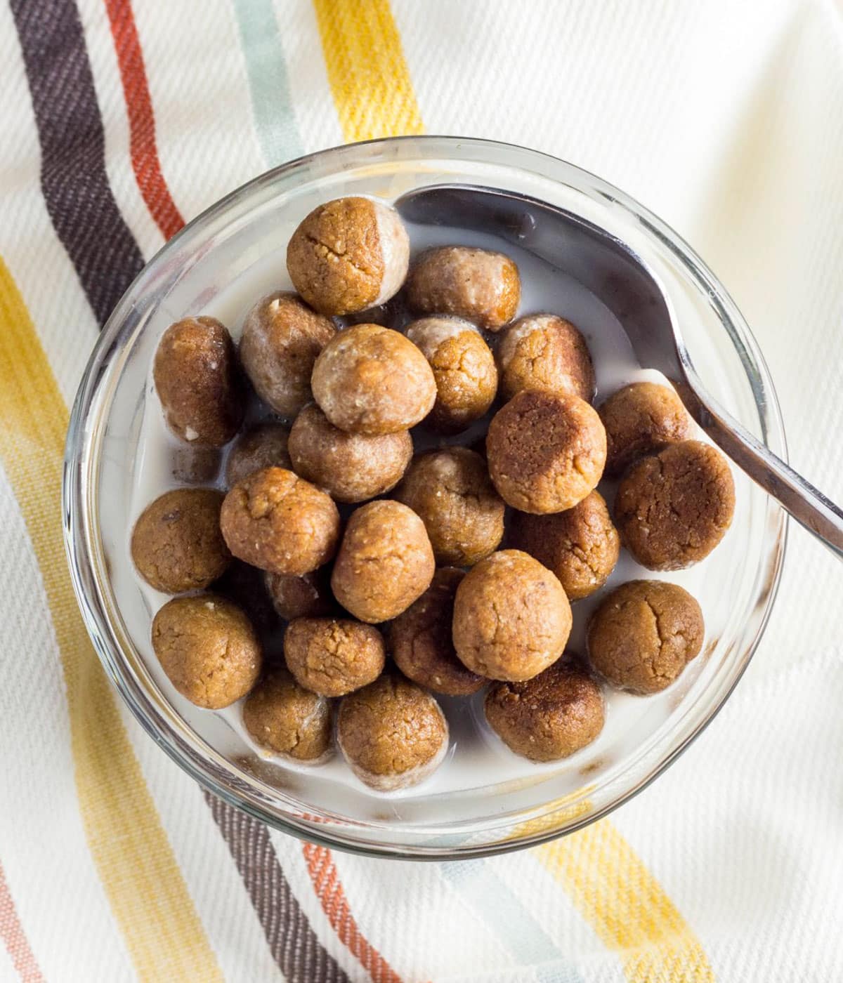 Overhead view of Peanut Butter Puff Cereal in a small bowl with non dairy milk.