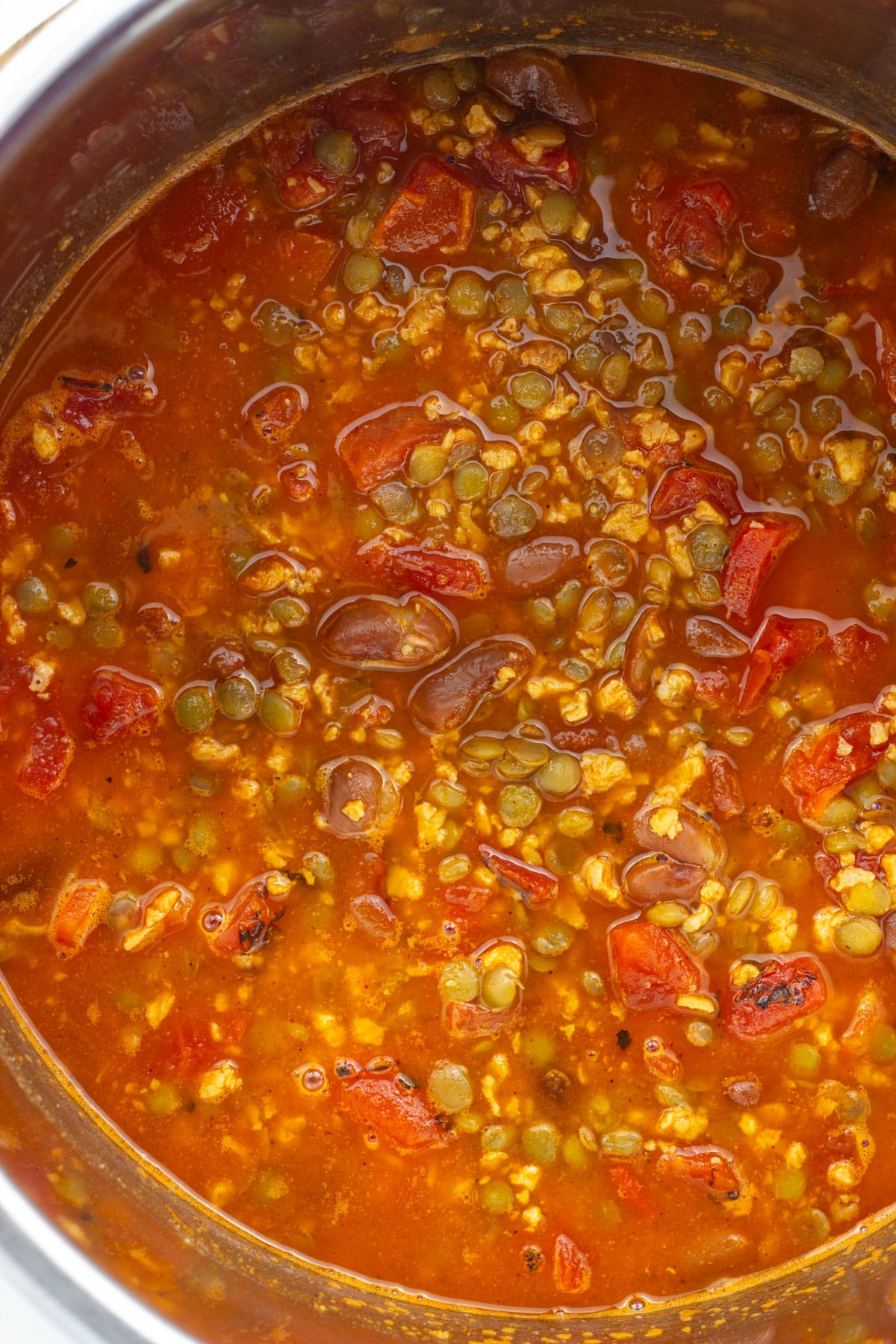 Close Up overhead view of TVP Chili simmering in a pot. This is a component of TVP Chili Stuffed Sweet Potatoes.