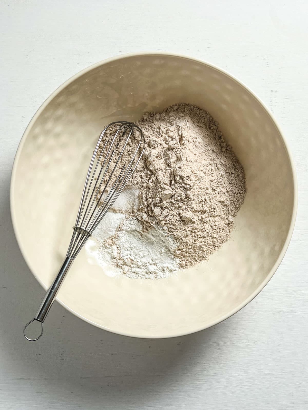 Overhead view of dry ingredients to make Pumpkin Cinnamon Swirl Quick Bread.
